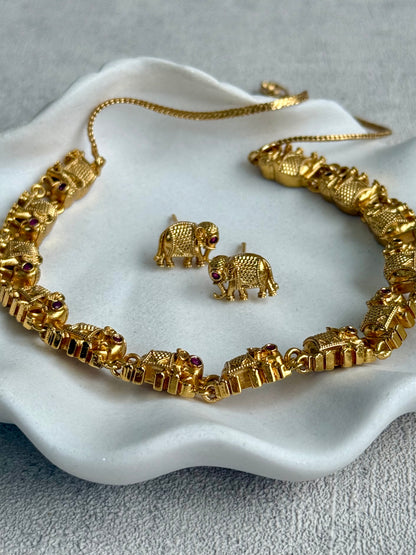 Ayura Designs Veda Set – Antique Gold Necklace & Stud Earrings with Elephant Motifs and Pink Stone Detailing