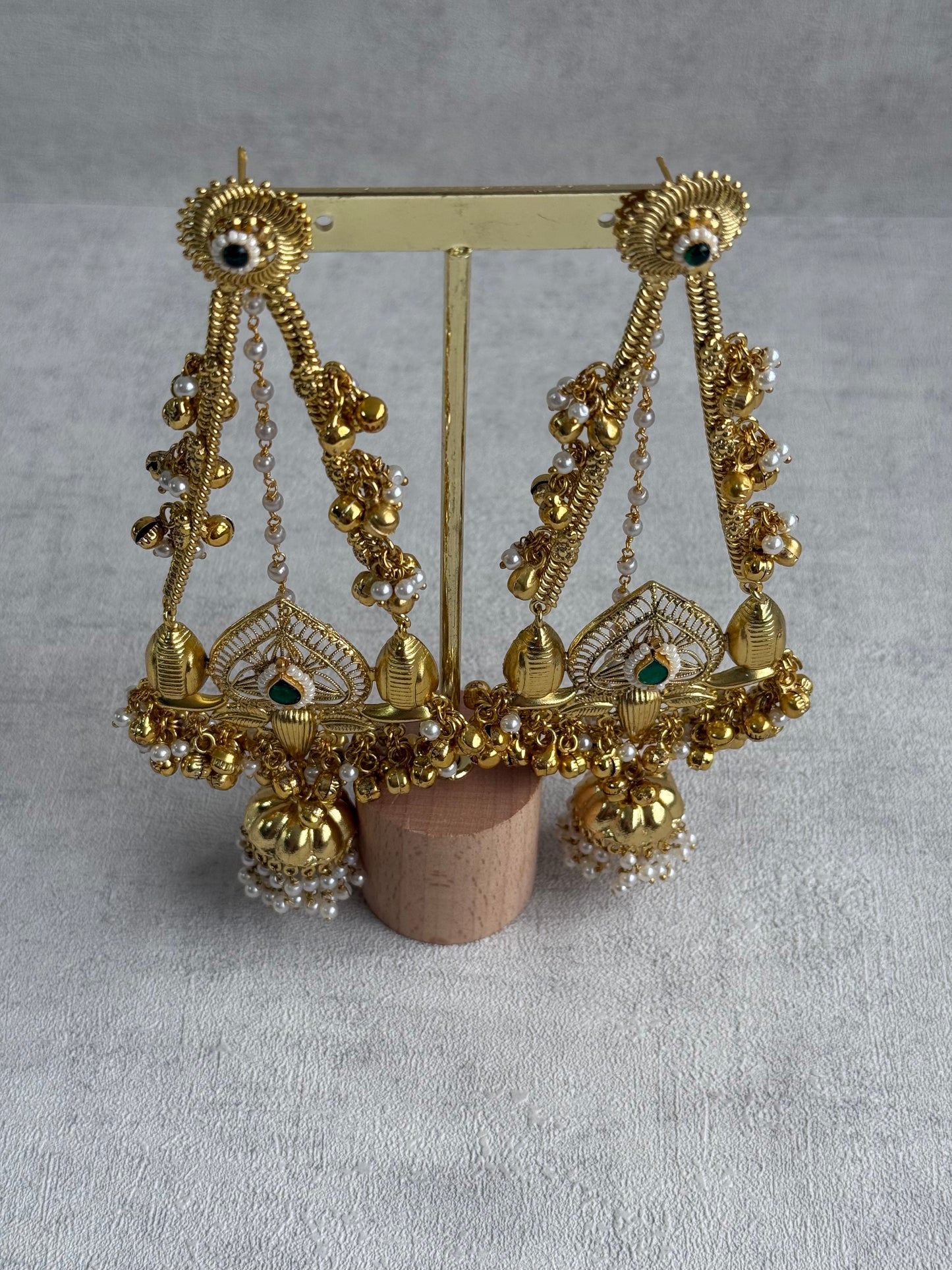 Ayura Designs Teja Earrings – Antique Gold Jhumkis with Emerald Stone & Pearl Detailing