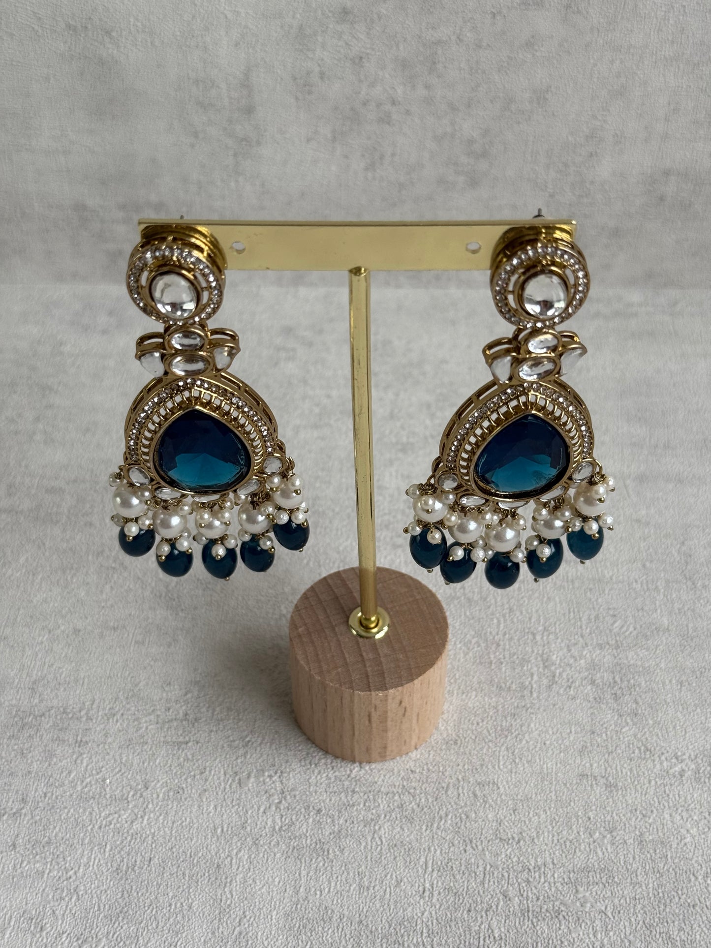 Ayura Designs Nageen Earrings – Antique Gold Jhumkis with Ink Blue Stones, Mirror-Cut Detailing & Pearl Drops