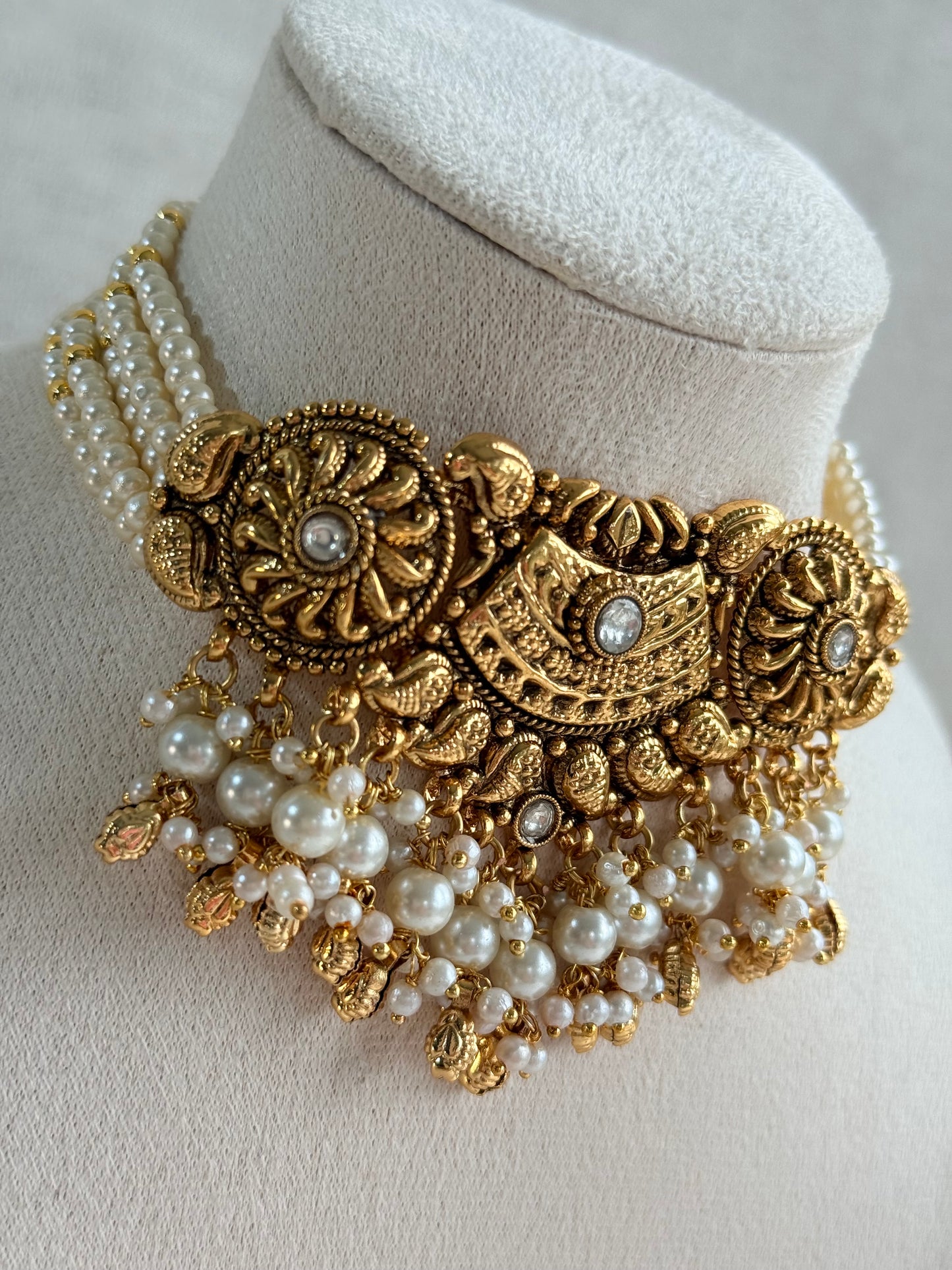 Ayura Designs Sairish Choker Set with Earrings & Tikka – Ivory Beads, Pearl Detailing, Ghungroos, Paisley Motifs & Antique Gold Finish