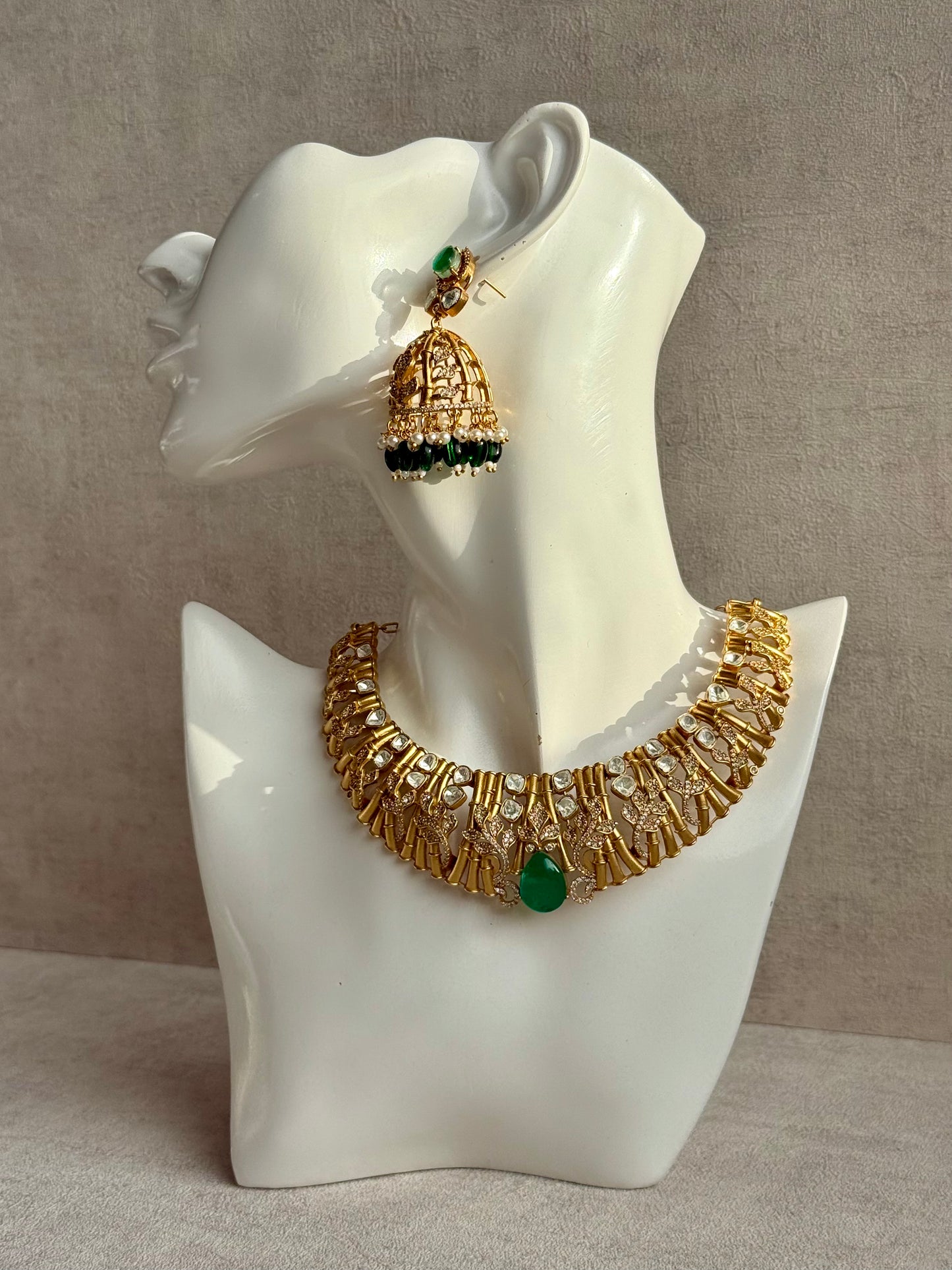 Ayura Designs Rami Collar Set with Jhumkis – Sculpted Gold Collar with Emerald Green Stone and Crystal Detailing