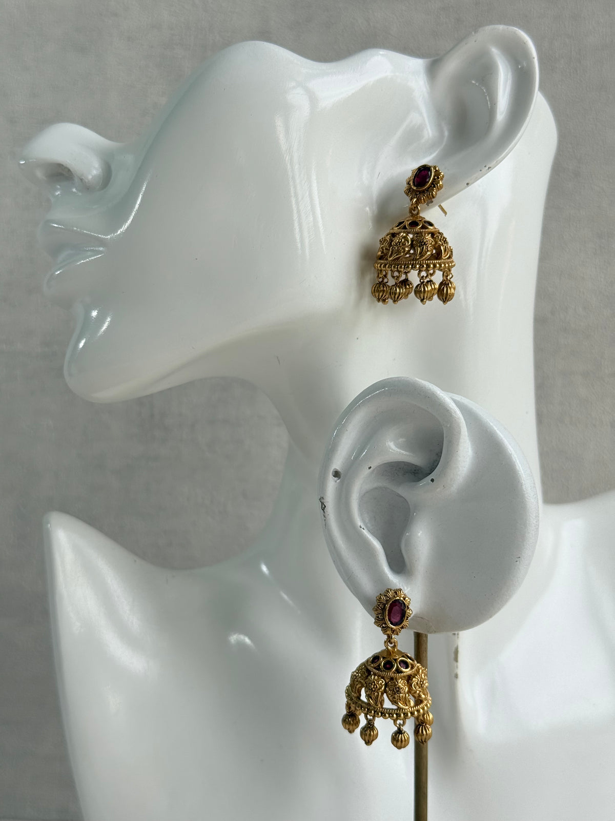 Ayura Designs Savya Jhumkis – Rani Pink Stones, Floral Motifs & Antique Gold Finish