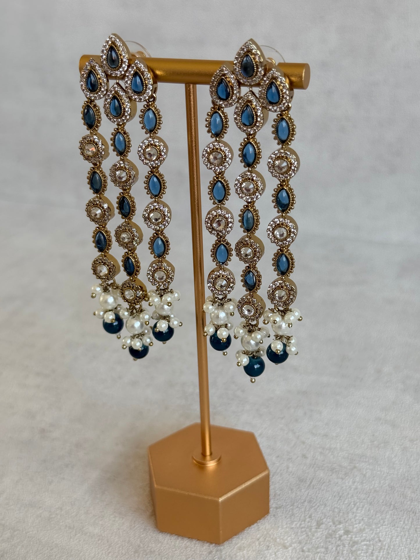 Ayura Designs Emilia Earrings – Gold Triple Strand Statement Earrings with Ink Blue Stones & Pearl Drops