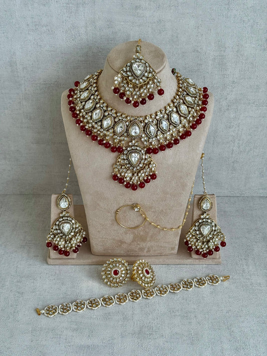 Ayura Designs Gulbahar Bridal Set with Necklace, Jhumkis, Tikka, Nath, Ring & Sheeshphool – Jadau Kundan Craftsmanship with Mirror-Cut Polki, Red Beads & Antique Gold Finish