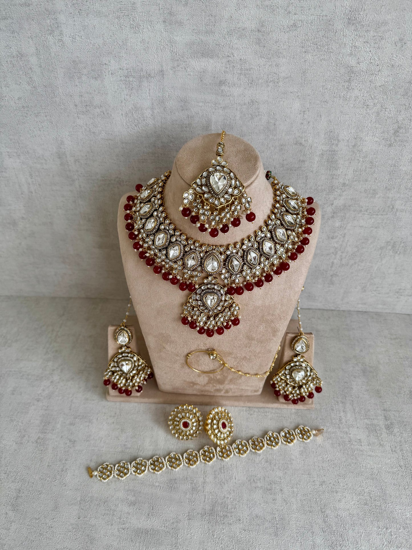 Ayura Designs Gulbahar Bridal Set with Necklace, Jhumkis, Tikka, Nath, Ring & Sheeshphool – Jadau Kundan Craftsmanship with Mirror-Cut Polki, Red Beads & Antique Gold Finish