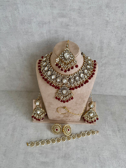 Ayura Designs Gulbahar Bridal Set with Necklace, Jhumkis, Tikka, Nath, Ring & Sheeshphool – Jadau Kundan Craftsmanship with Mirror-Cut Polki, Red Beads & Antique Gold Finish