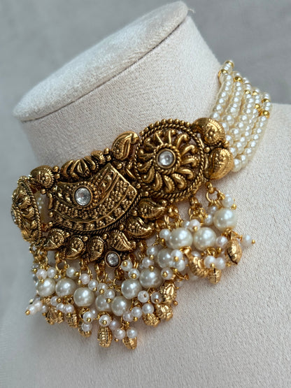 Ayura Designs Sairish Choker Set with Earrings & Tikka – Ivory Beads, Pearl Detailing, Ghungroos, Paisley Motifs & Antique Gold Finish