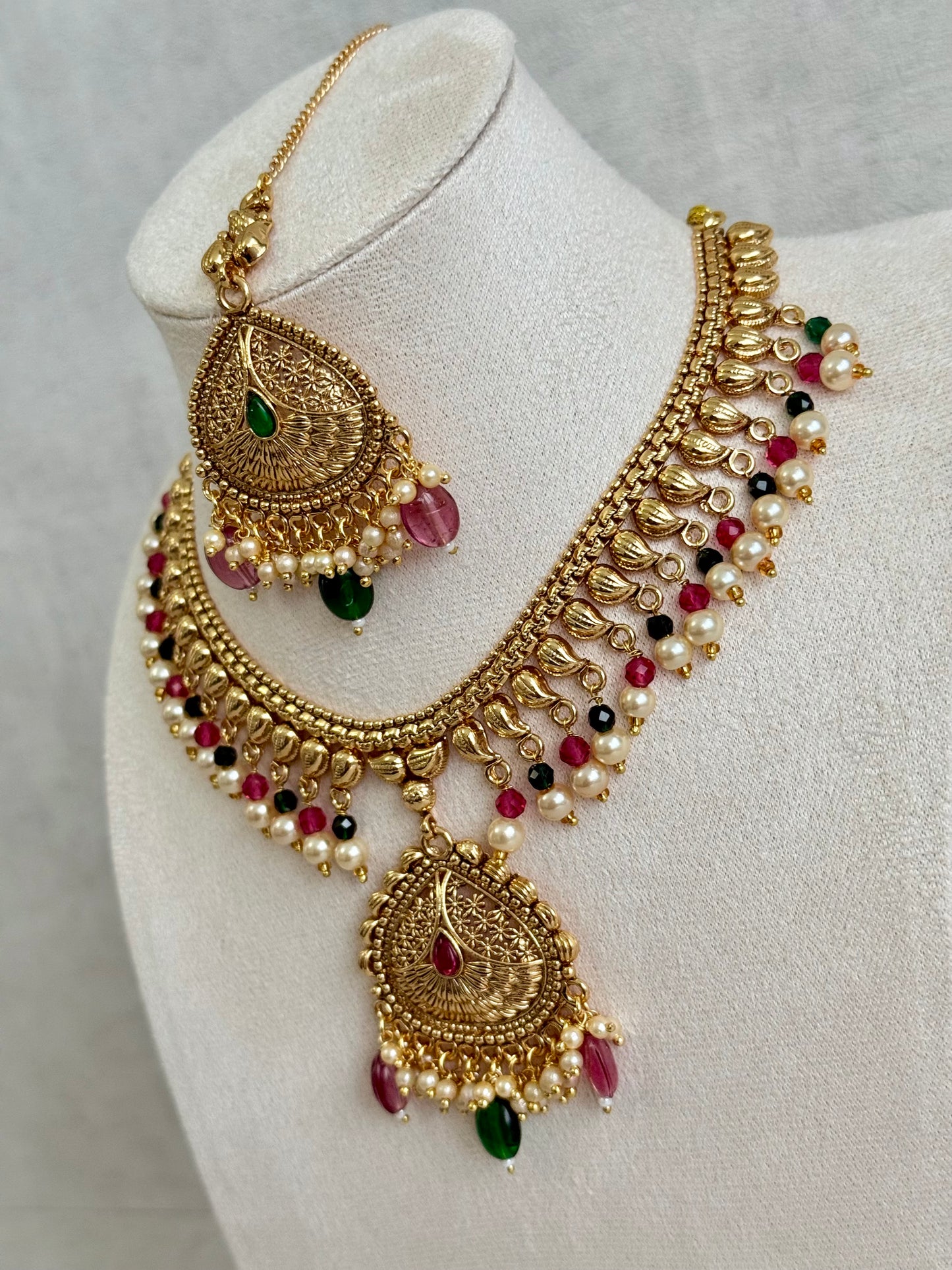 Ayura Designs Hamida Set with Necklace, Earrings & Tikka – Antique Gold with Ruby Pink and Emerald Green Beads & Pearl Detailing