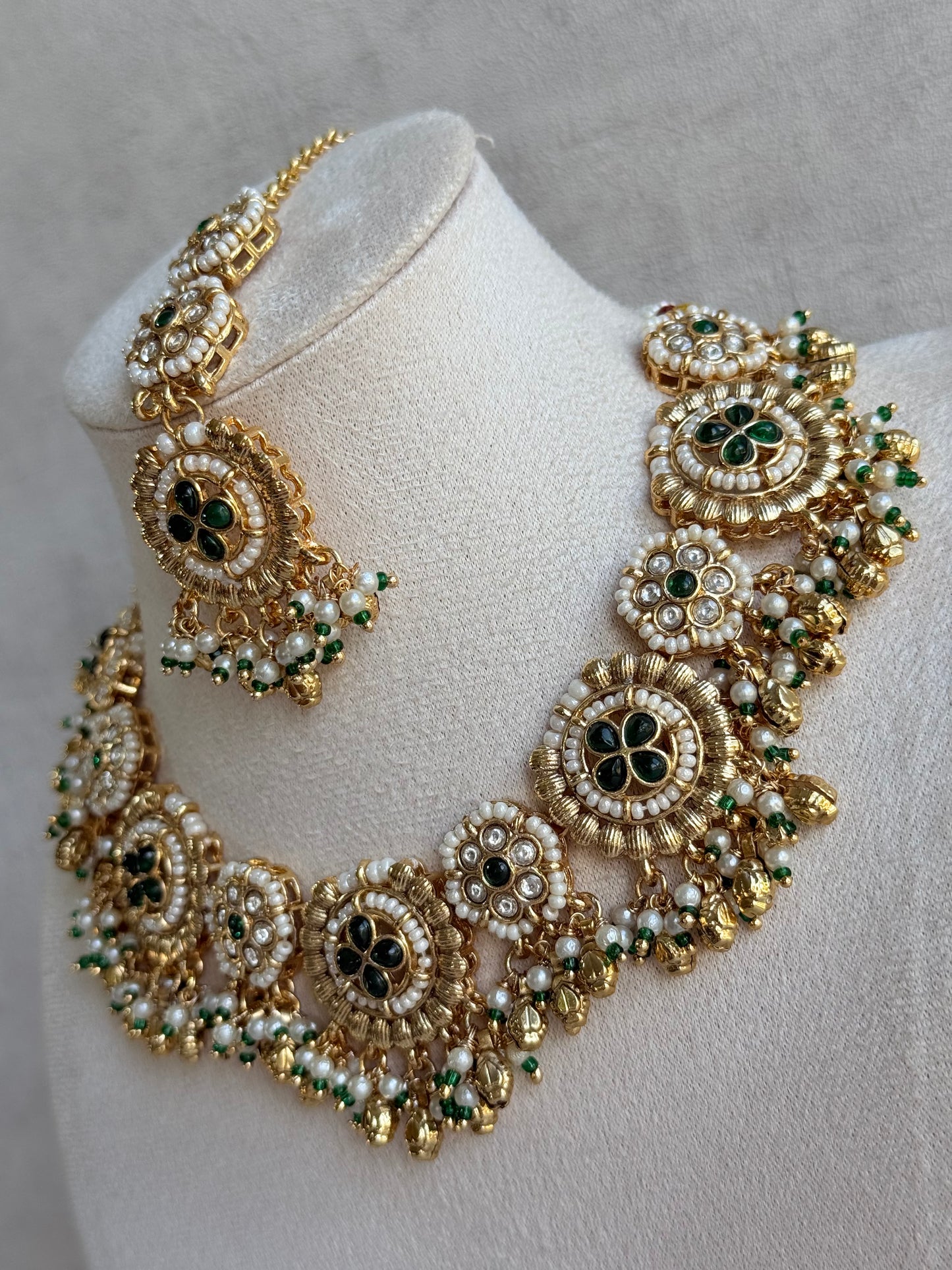 Ayura Designs Manika Necklace Set with Earrings & Tikka – Gold Finish with Emerald Green Stones, Pearls & Ghungroos