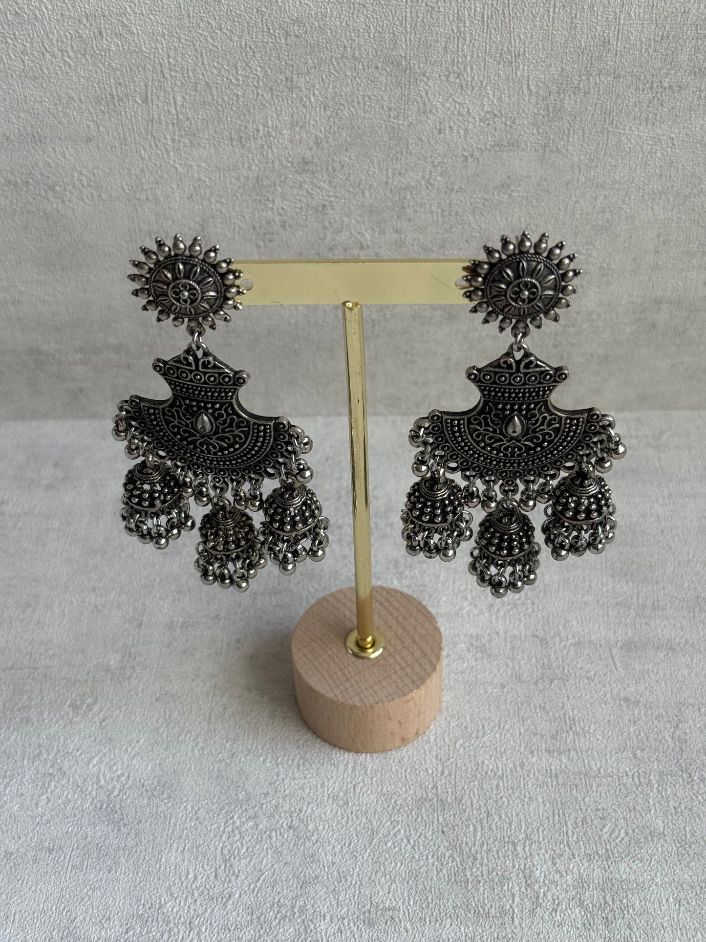 Ayura Designs Mahfar Earrings – Oxidised Silver Jhumkas with Sunburst Tops & Triple Dome Drops