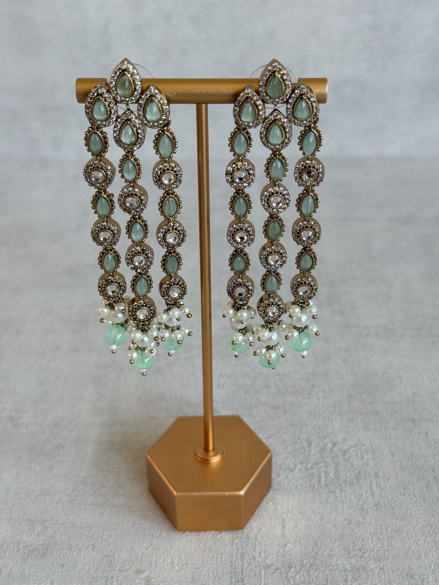 Ayura Designs Emilia Earrings – Gold Triple Strand Statement Earrings with Mint Green Stones & Pearl Drops