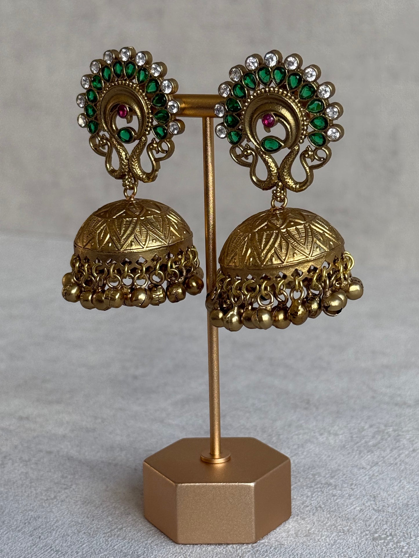 Ayura Designs Moraya Jhumkis – Emerald Green Peacock Motif with Antique Gold Detailing