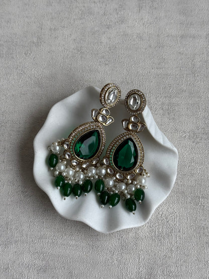 Ayura Designs Nageen Earrings – Antique Gold Jhumkis with Emerald Green Stones, Mirror-Cut Accents & Pearl Drops