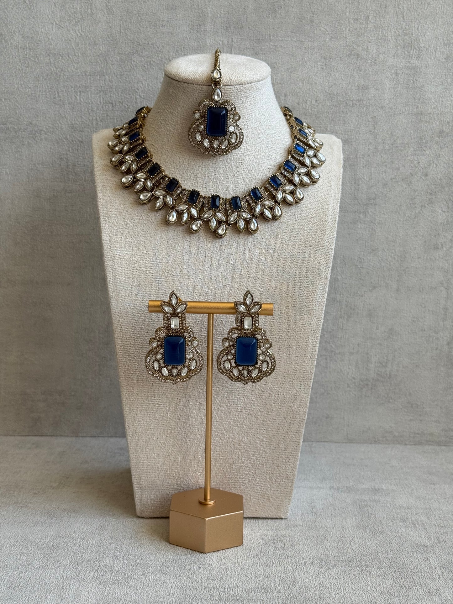 Ayura Designs Olivia Set with Necklace, Earrings & Tikka – Navy Blue Stones, Pear-Cut White Accents & Antique Gold Finish