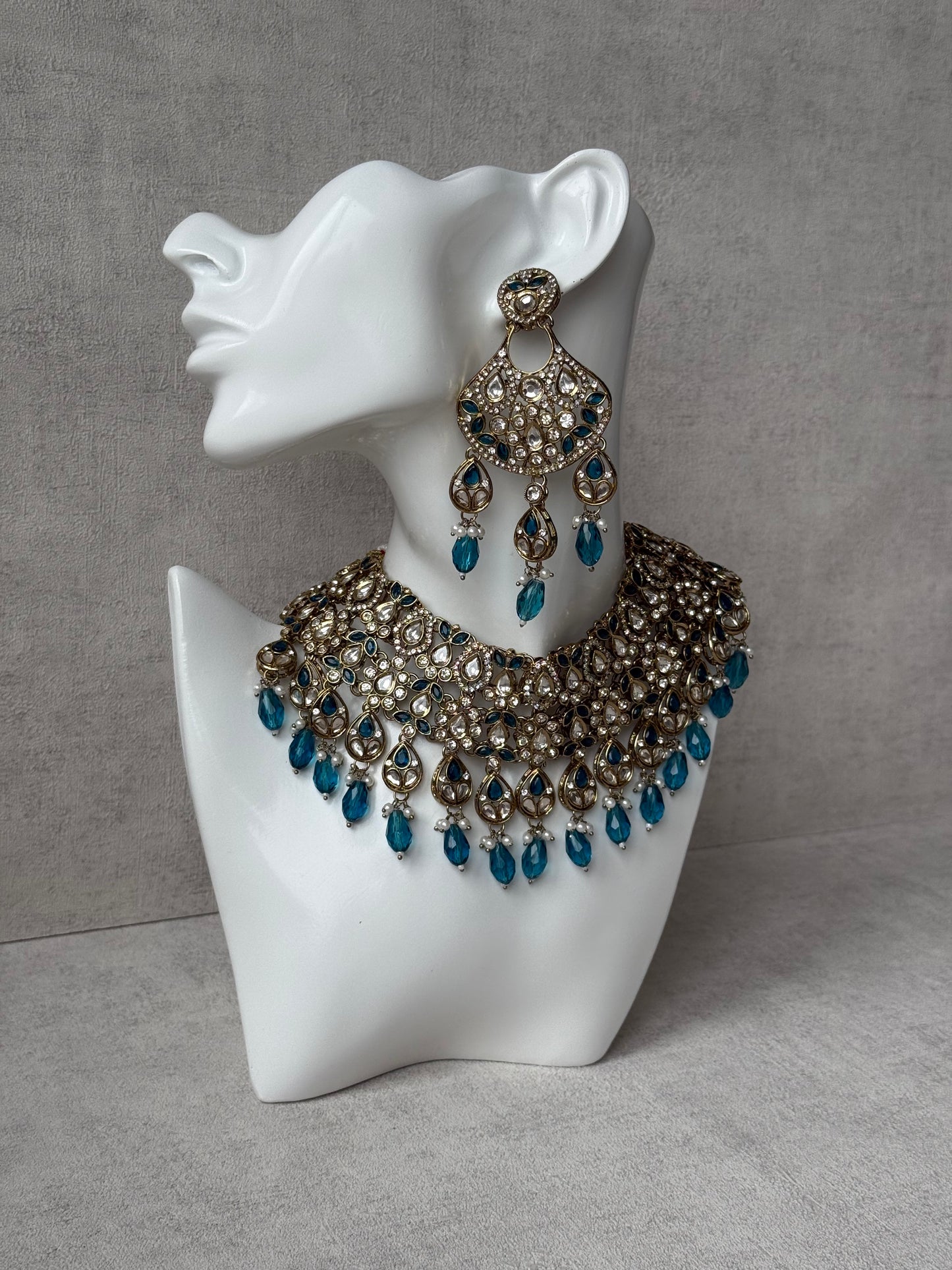 Ayura Designs Hoorain Set with Earrings – Antique Gold Finish, Mirror-Cut Stones & Peacock Blue Beads