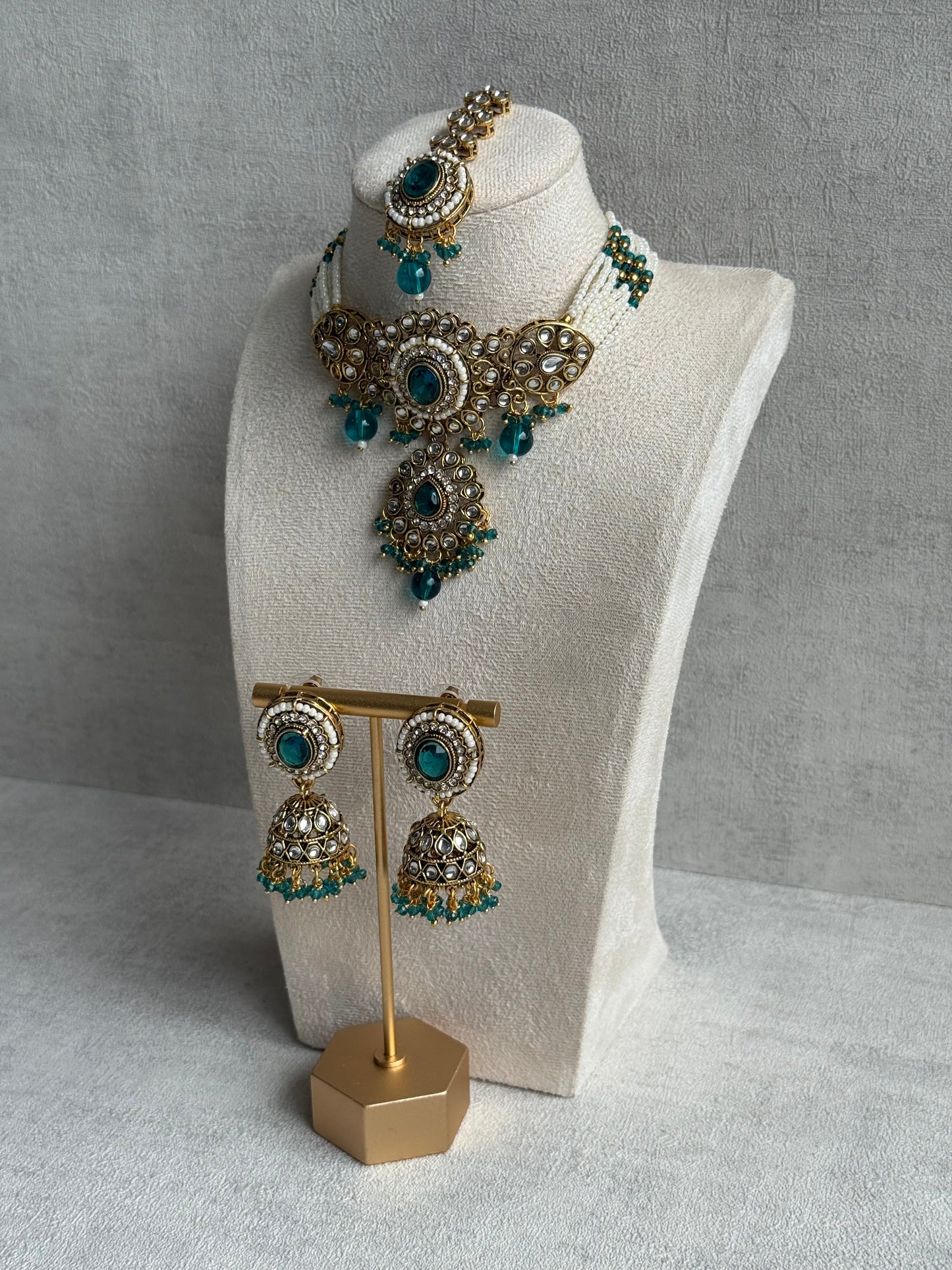 Ayura Designs Muskaan Set – Choker, Jhumkis & Tikka with Peacock Blue Beads, Kundan Stones & Antique Gold Finish