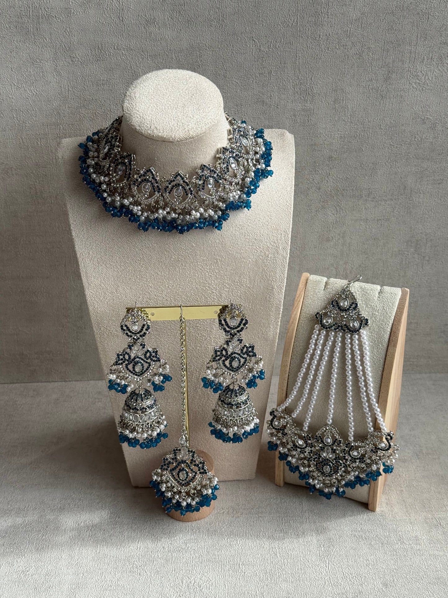 Ayura Designs Wania Set with Jhumkis, Tikka & Passa – Peacock Blue Beads, Mirror-Cut Stones & Antique Silver Finish