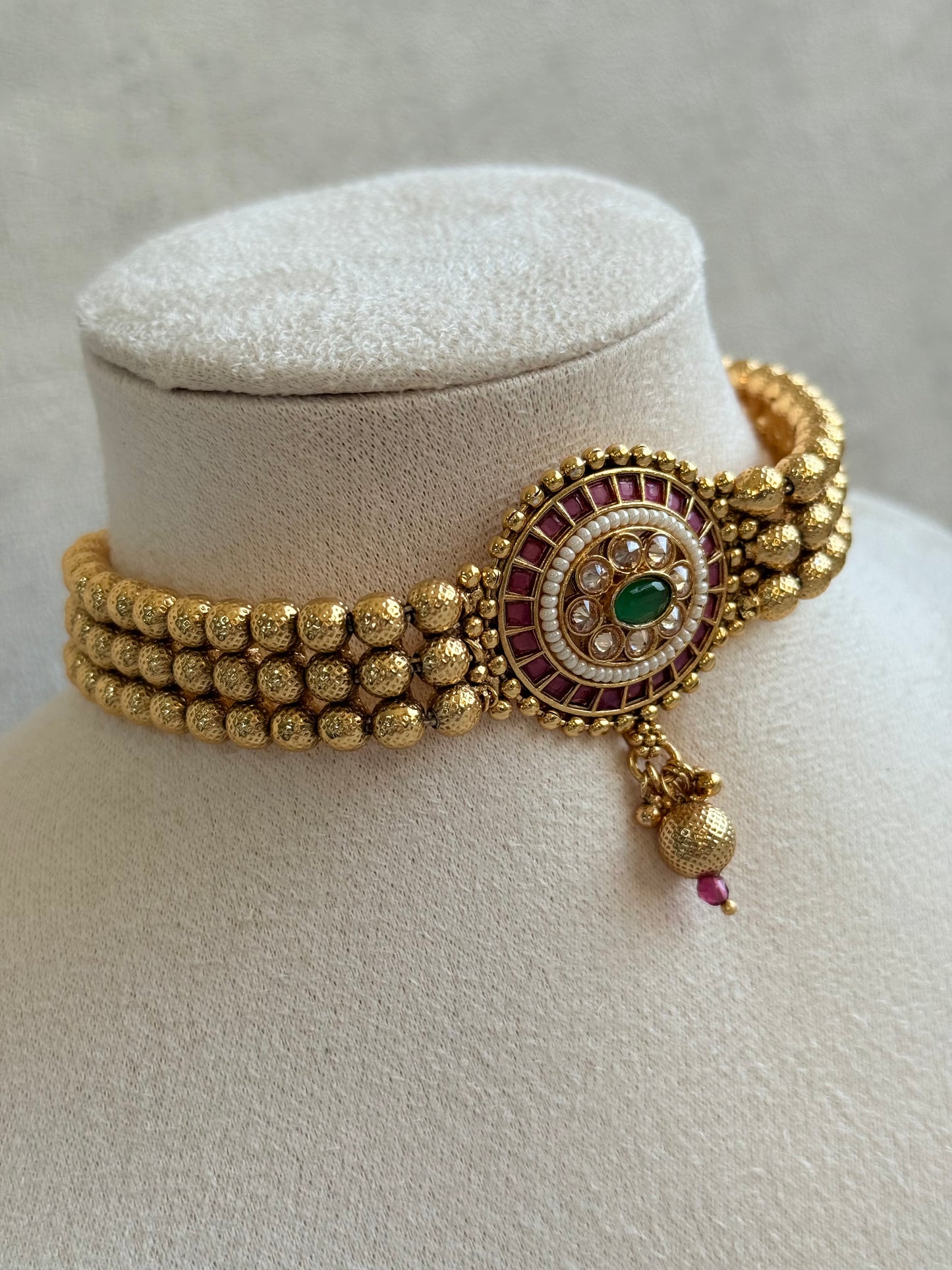 Ayura Designs Kavish Choker Set – Antique Gold Choker with Jhumkis in Rani Pink & Emerald Green with Pearl Detailing
