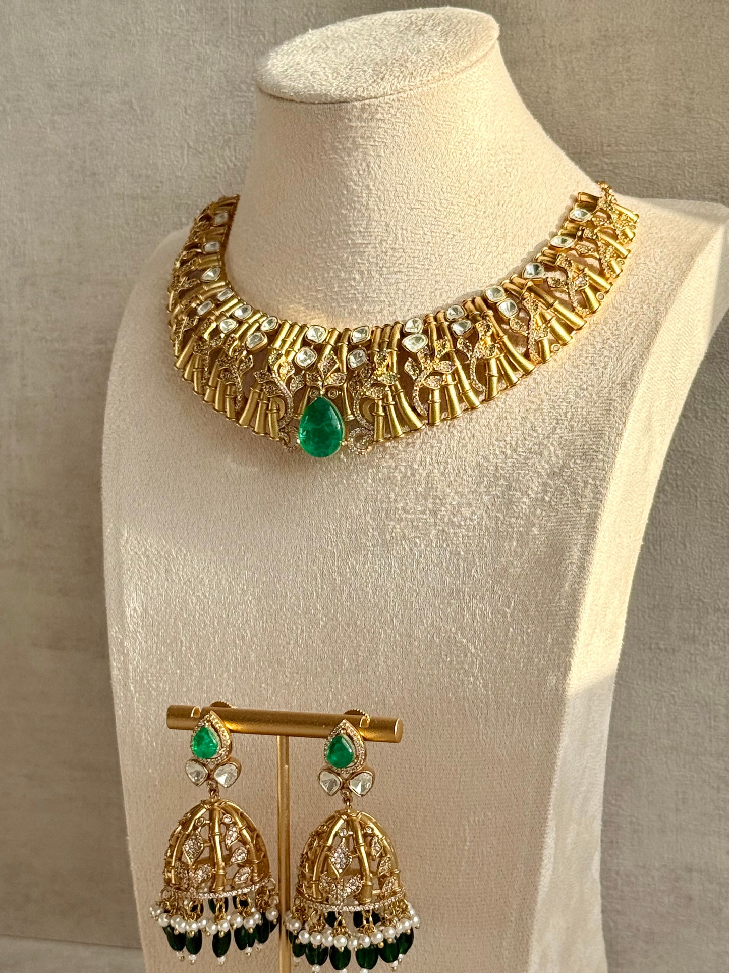 Ayura Designs Rami Collar Set with Jhumkis – Sculpted Gold Collar with Emerald Green Stone and Crystal Detailing