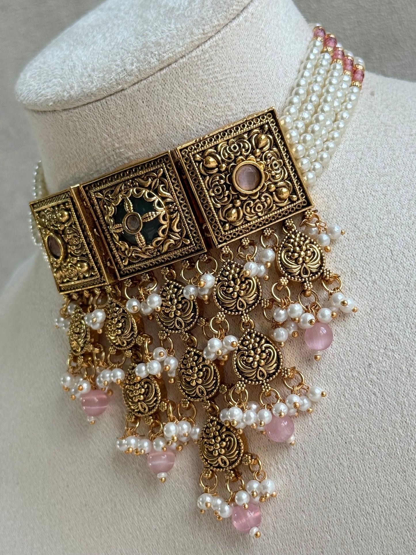 Ayura Designs Samera Choker Set with Earrings & Tikka – Blush Pink Beads, Pearl Detailing, Green Centre Stone, Floral Motifs & Antique Gold Finish