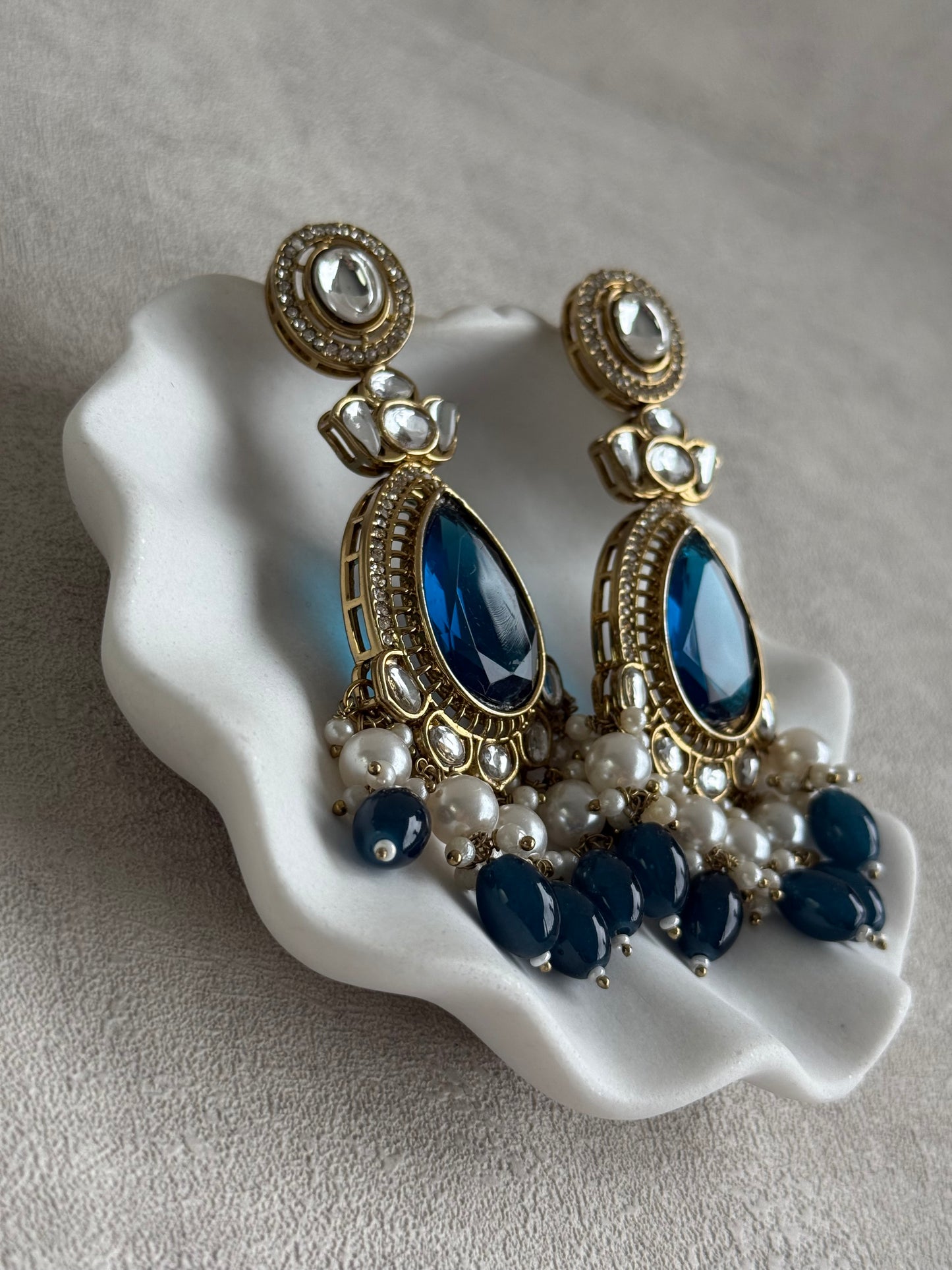 Ayura Designs Nageen Earrings – Antique Gold Jhumkis with Ink Blue Stones, Mirror-Cut Detailing & Pearl Drops