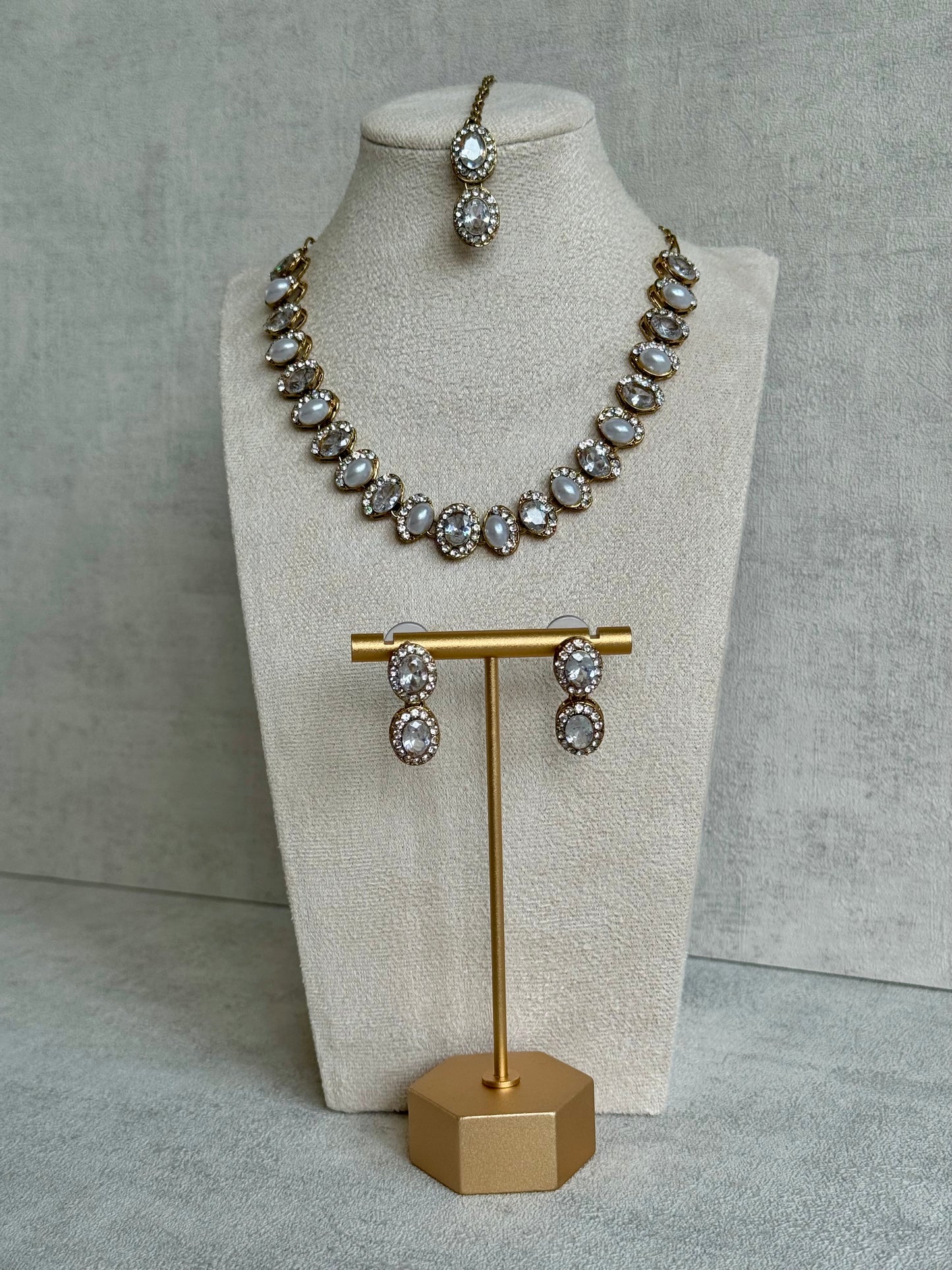 Ayura Designs Eira Set – Necklace, Earrings & Tikka with Diamond-Cut & Ivory Oval Stones in Antique Gold