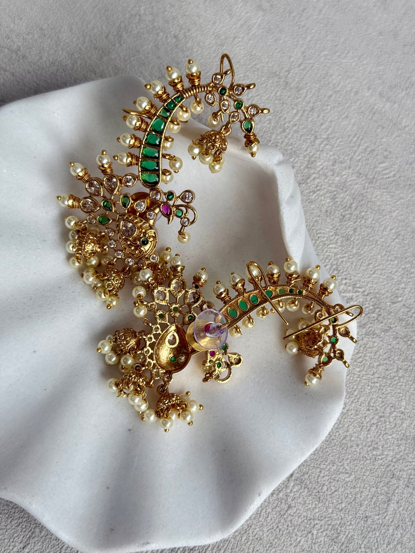 Ayura Designs Megha Half Ear Cuffs – Gold Peacock Motif with Crystal Stones, Emerald & Pink Accents and Pearl Jhumka Drops