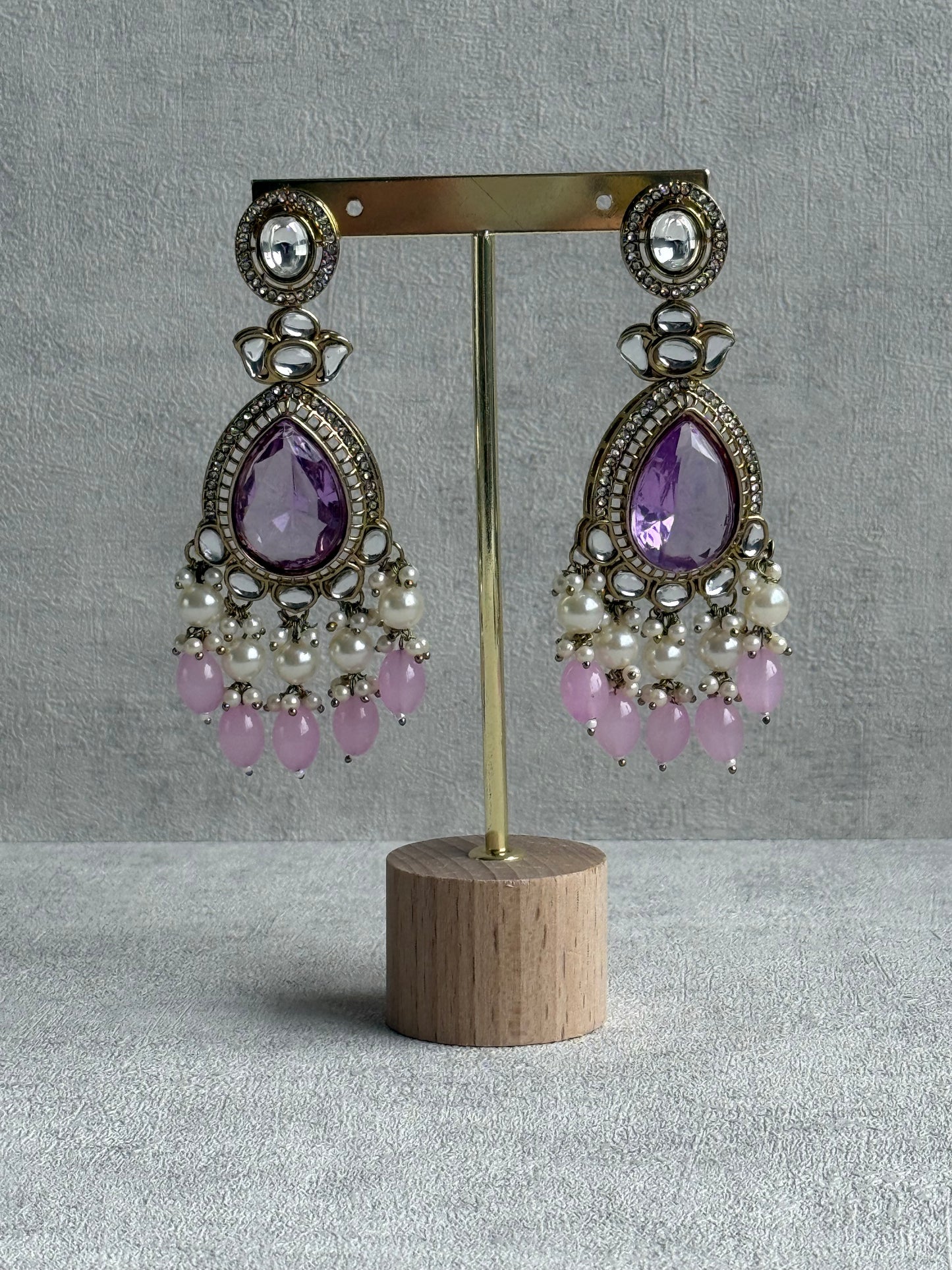Ayura Designs Nageen Earrings – Antique Gold Jhumkis with Lilac Stones, Mirror-Cut Accents & Pearl Drops