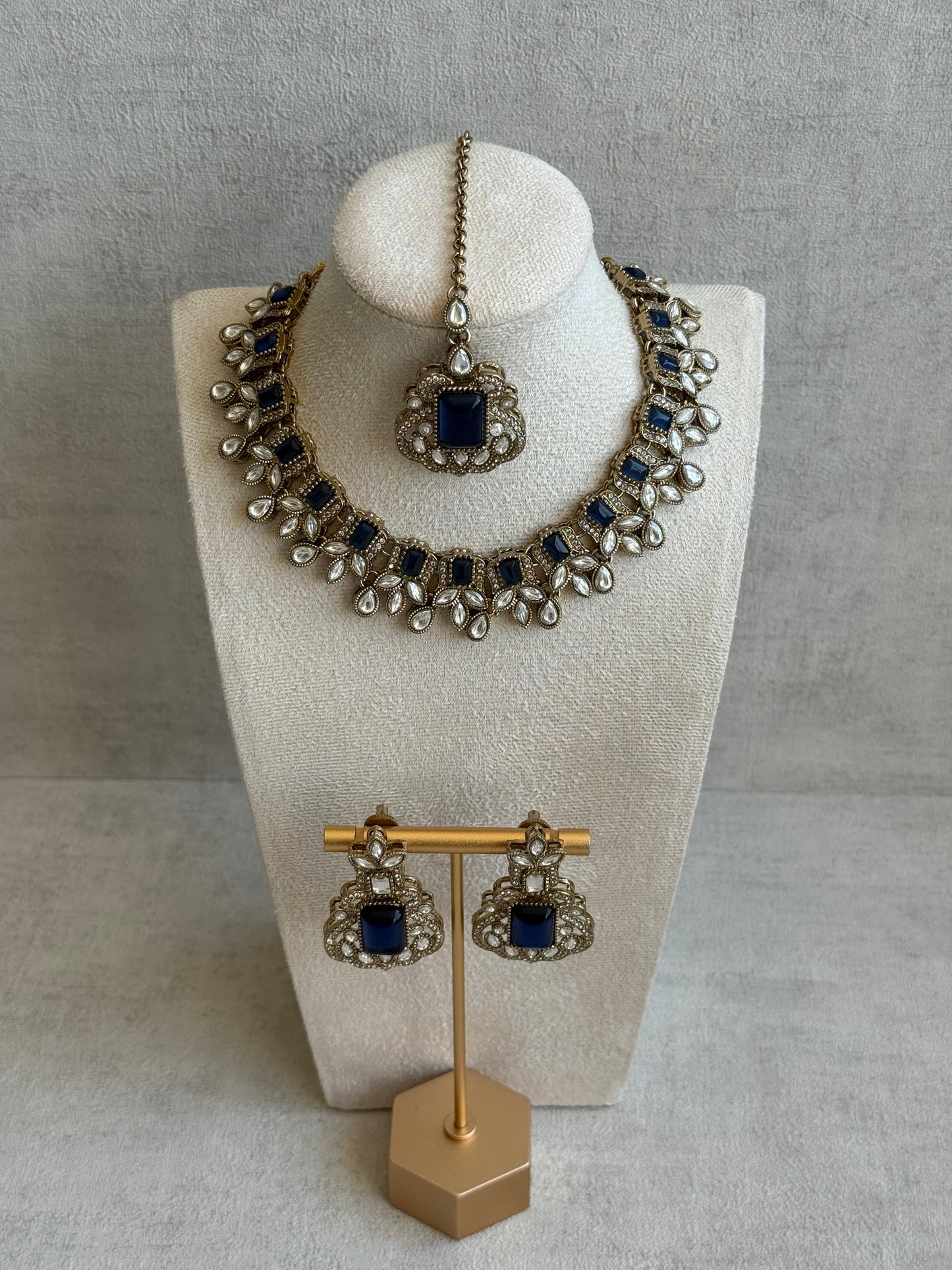 Ayura Designs Olivia Set with Necklace, Earrings & Tikka – Navy Blue Stones, Pear-Cut White Accents & Antique Gold Finish