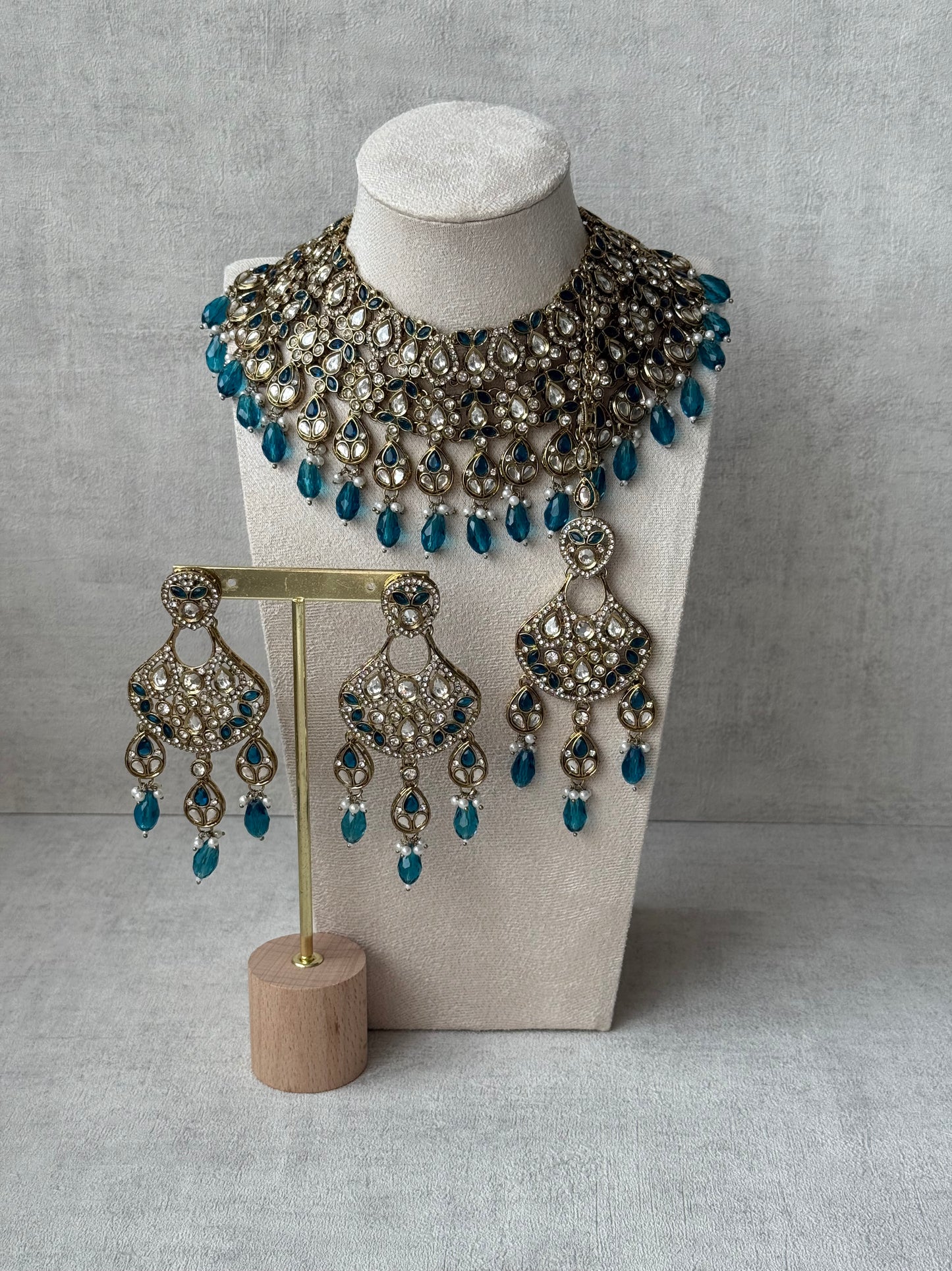 Ayura Designs Hoorain Set with Earrings – Antique Gold Finish, Mirror-Cut Stones & Peacock Blue Beads