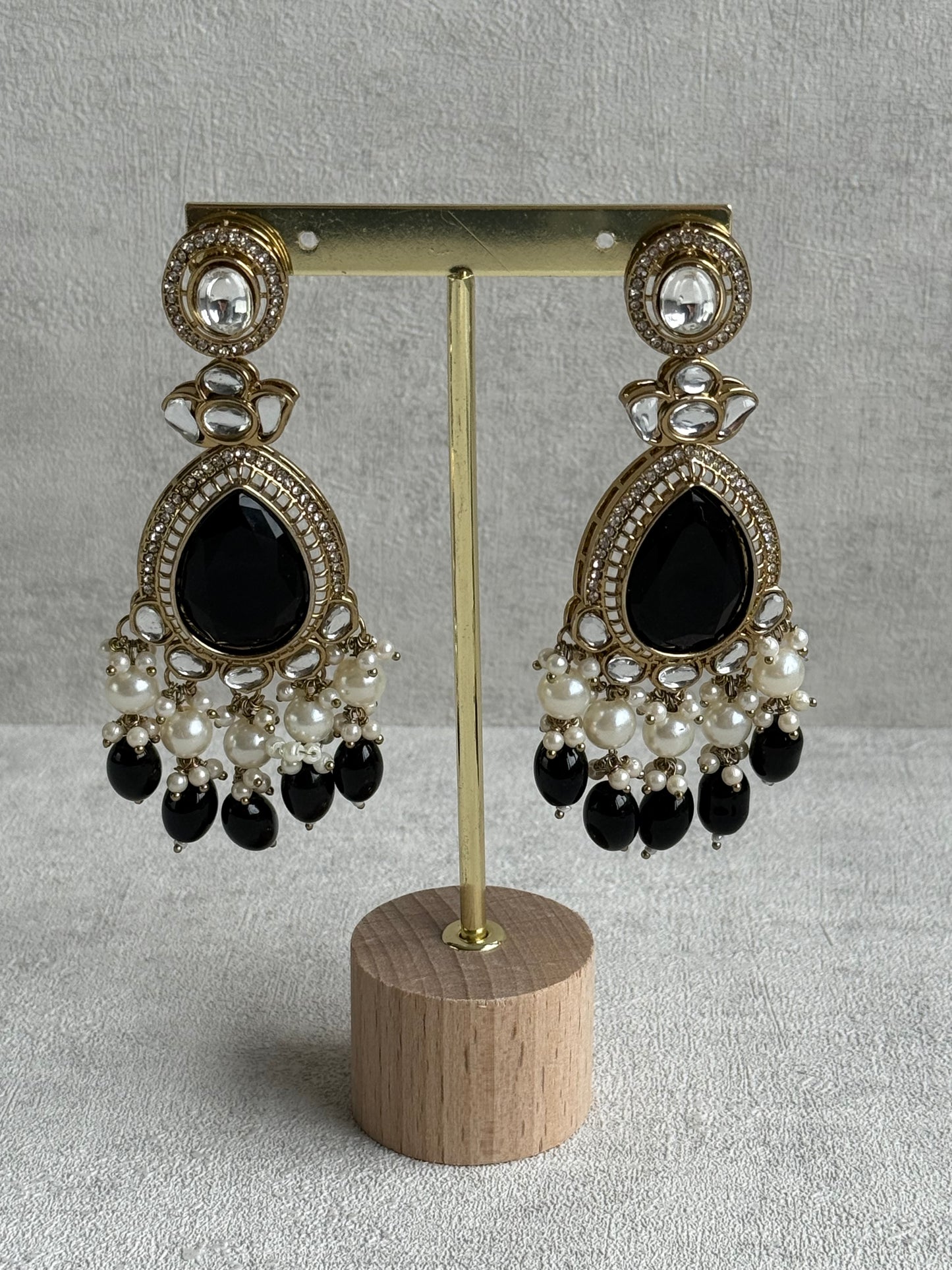 Ayura Designs Nageen Earrings – Antique Gold Jhumkis with Black Stones, Mirror-Cut Accents & Pearl Drops