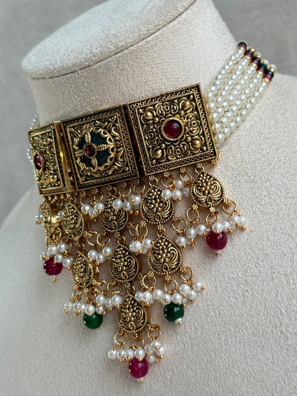 Ayura Designs Samera Choker Set with Earrings & Tikka – Rani Pink & Emerald Green Beads, Pearl Detailing, Green Centre Stone, Floral Motifs & Antique Gold Finish