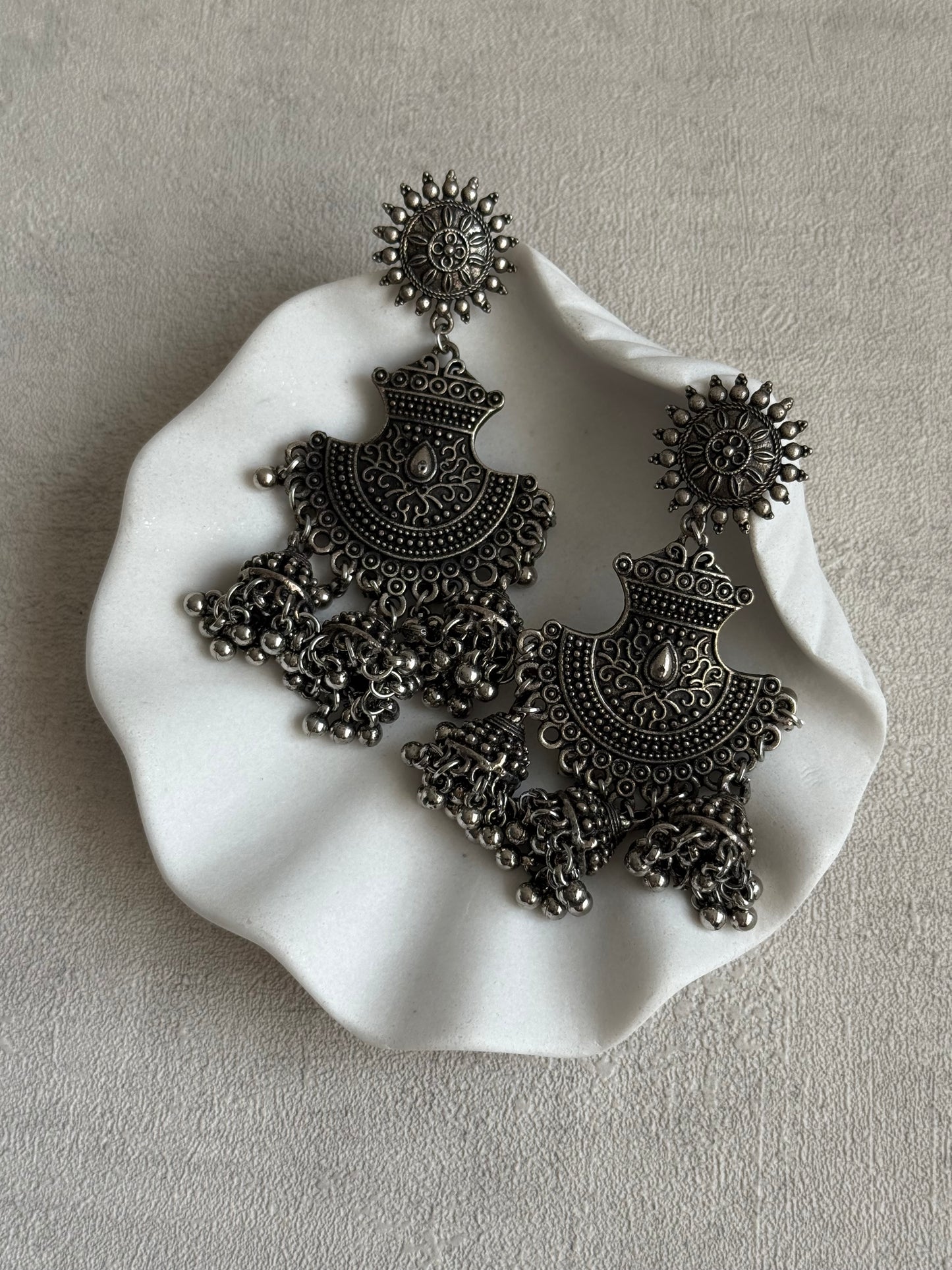 Ayura Designs Mahfar Earrings – Oxidised Silver Jhumkas with Sunburst Tops & Triple Dome Drops