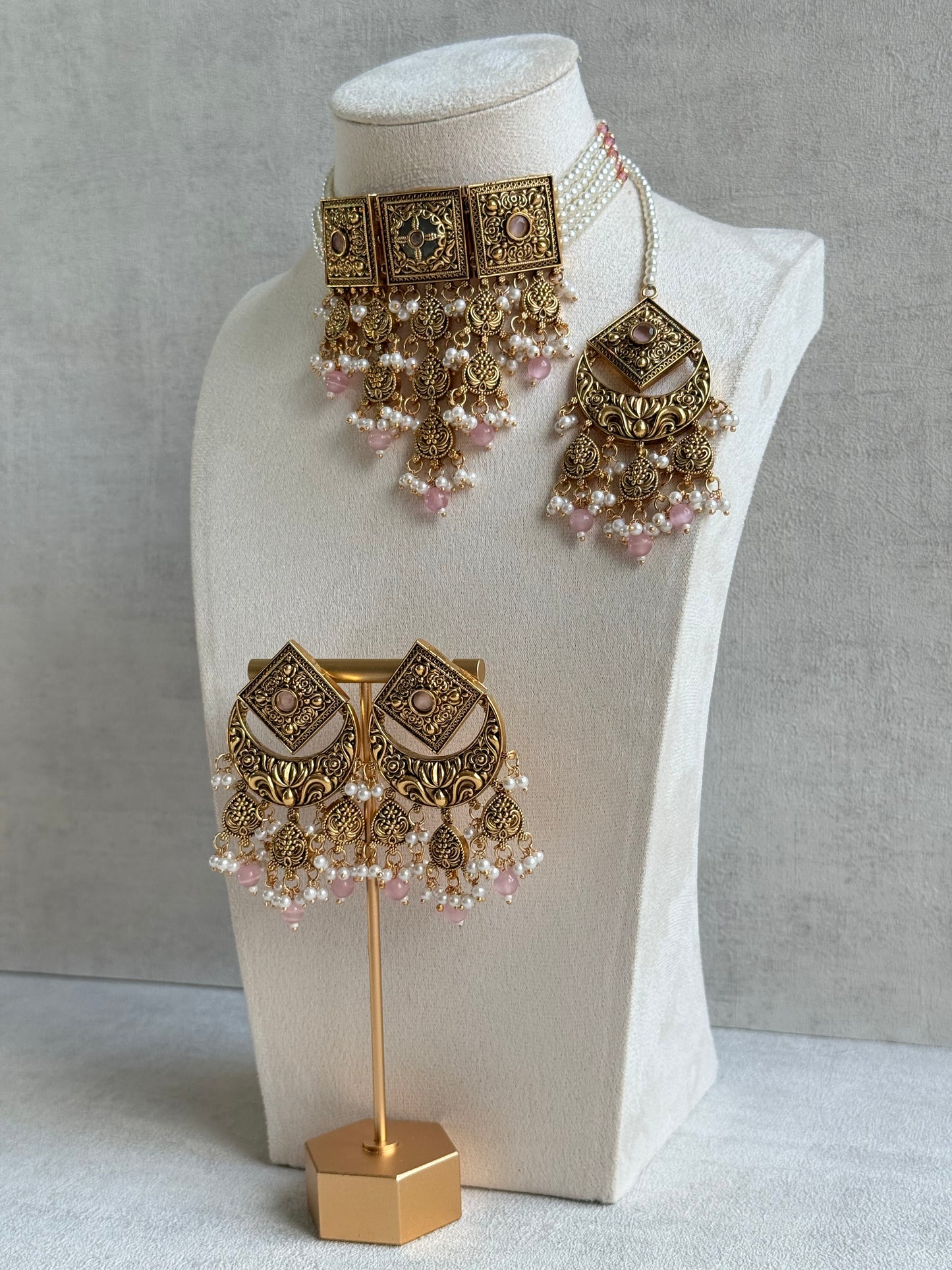 Ayura Designs Samera Choker Set with Earrings & Tikka – Blush Pink Beads, Pearl Detailing, Green Centre Stone, Floral Motifs & Antique Gold Finish