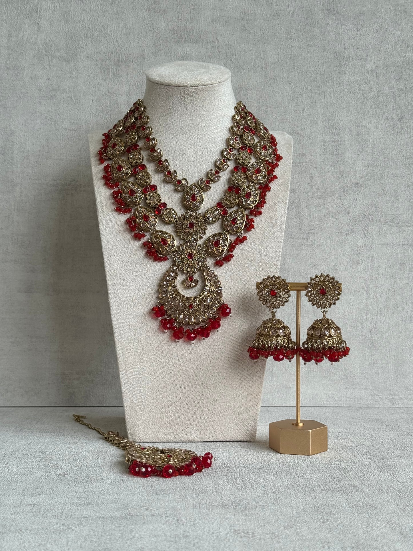 Ayura Designs Samreen Set with Tikka & Jhumkis – in Antique Gold with Red Beads & Mirror-Cut Stones