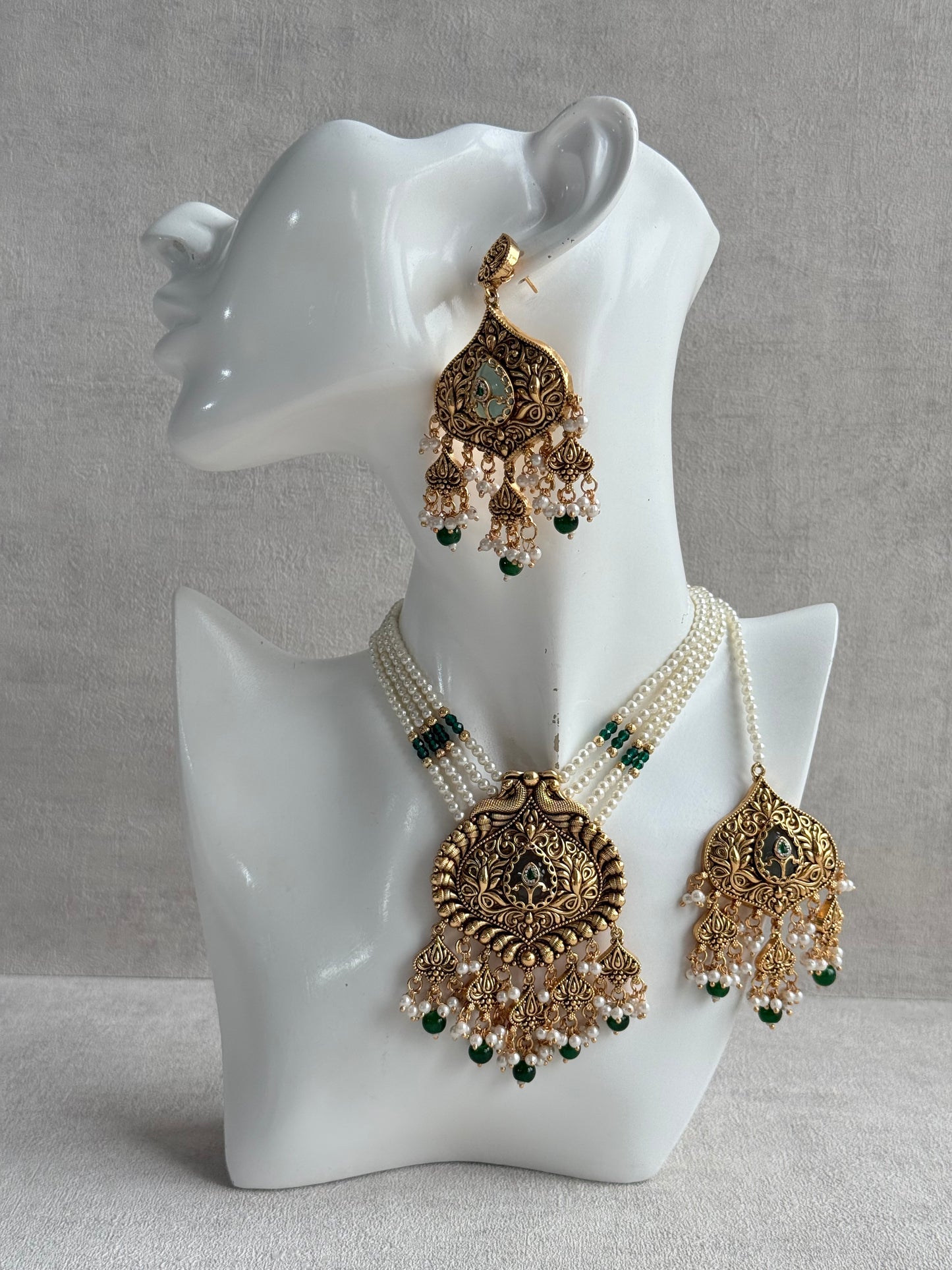 Ayura Designs Afia Necklace Set with Earrings & Tikka – Antique Gold, Emerald Green Beads, Green Centre Stone & Peacock Motifs