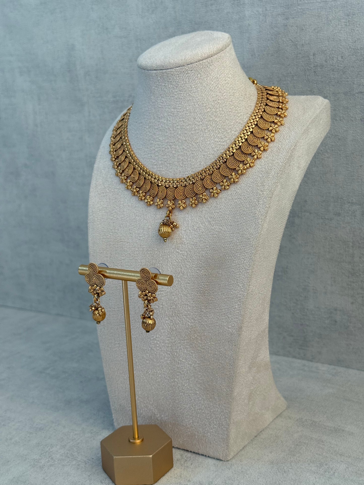 Ayura Designs Purna Set with Necklace & Earrings – Antique Gold Finish, Floral Motifs & Textured Pendant Detail