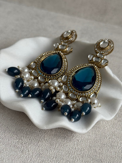 Ayura Designs Nageen Earrings – Antique Gold Jhumkis with Ink Blue Stones, Mirror-Cut Detailing & Pearl Drops