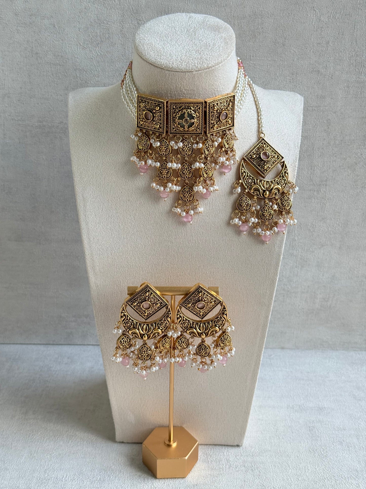 Ayura Designs Samera Choker Set with Earrings & Tikka – Blush Pink Beads, Pearl Detailing, Green Centre Stone, Floral Motifs & Antique Gold Finish