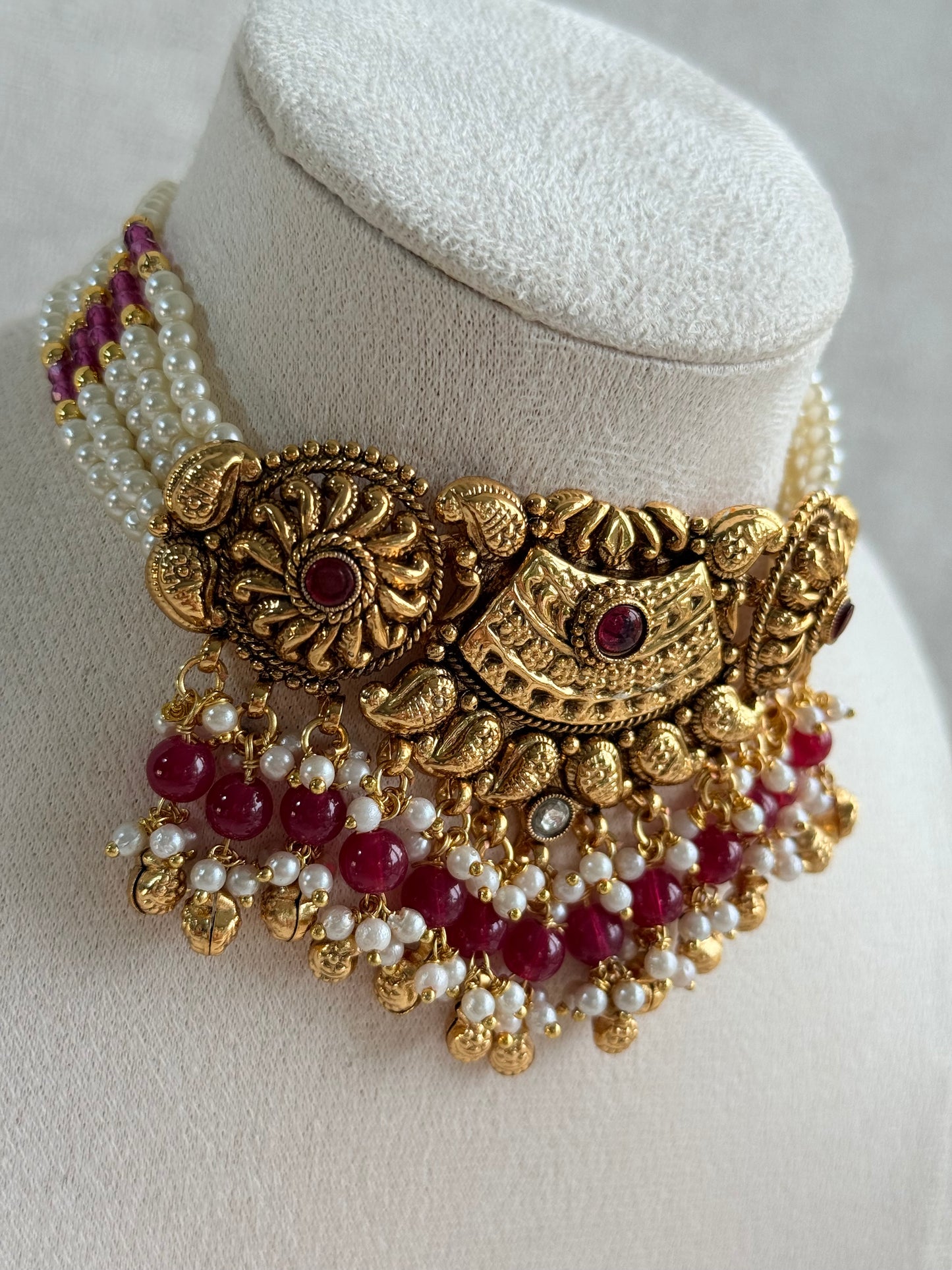Ayura Designs Sairish Choker Set with Earrings & Tikka – Ruby Pink Beads, Pearl Detailing, Ghungroos, Paisley Motifs & Antique Gold Finish