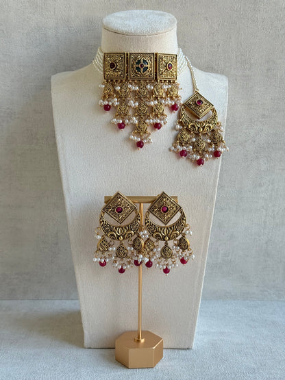 Ayura Designs Samera Choker Set with Earrings & Tikka – Rani Pink Beads, Pearl Detailing, Green Centre Stone, Floral Motifs & Antique Gold Finish