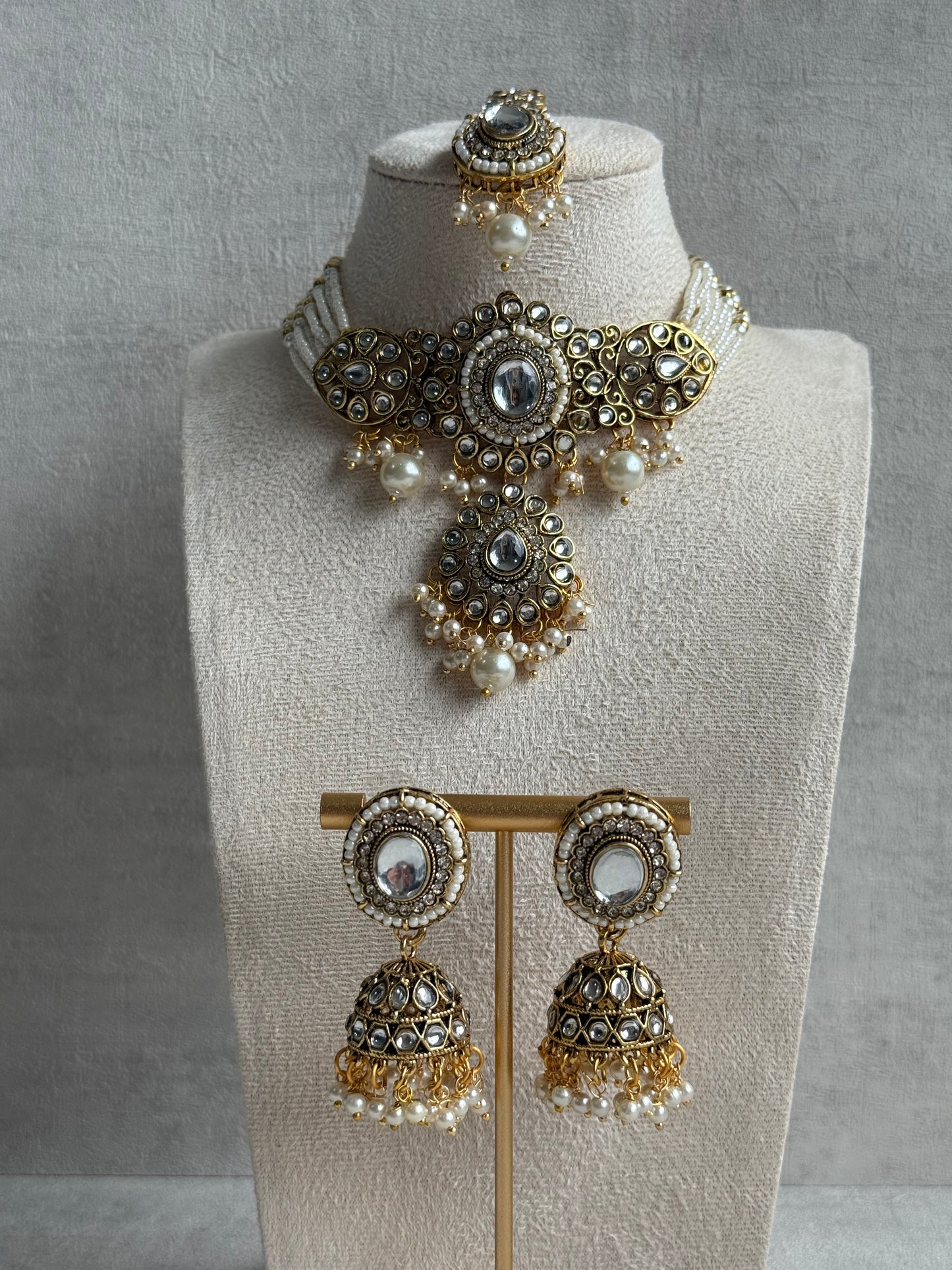 Ayura Designs Muskaan Set – Choker, Jhumkis & Tikka with Ivory Pearls, Mirror-Cut Kundan Stones & Antique Gold Finish