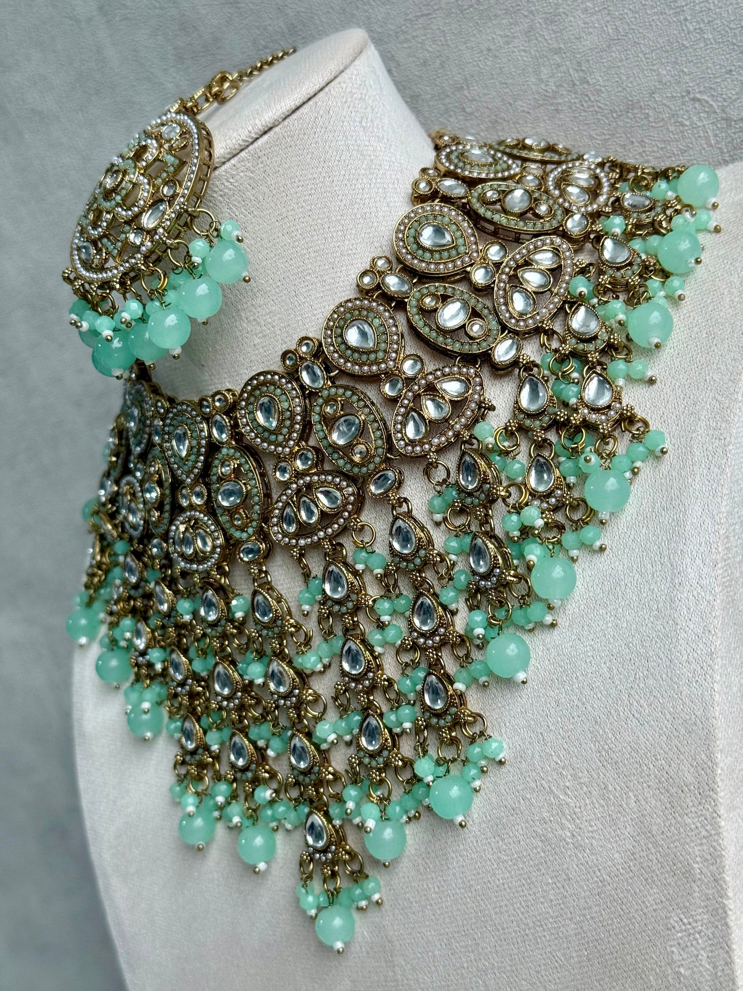 Ayura is Designs Tanya Bridal Set with Necklace, Earrings & Tikka – Pistachio Mint Beads, Mirror-Cut Stones and Antique Gold Finish
