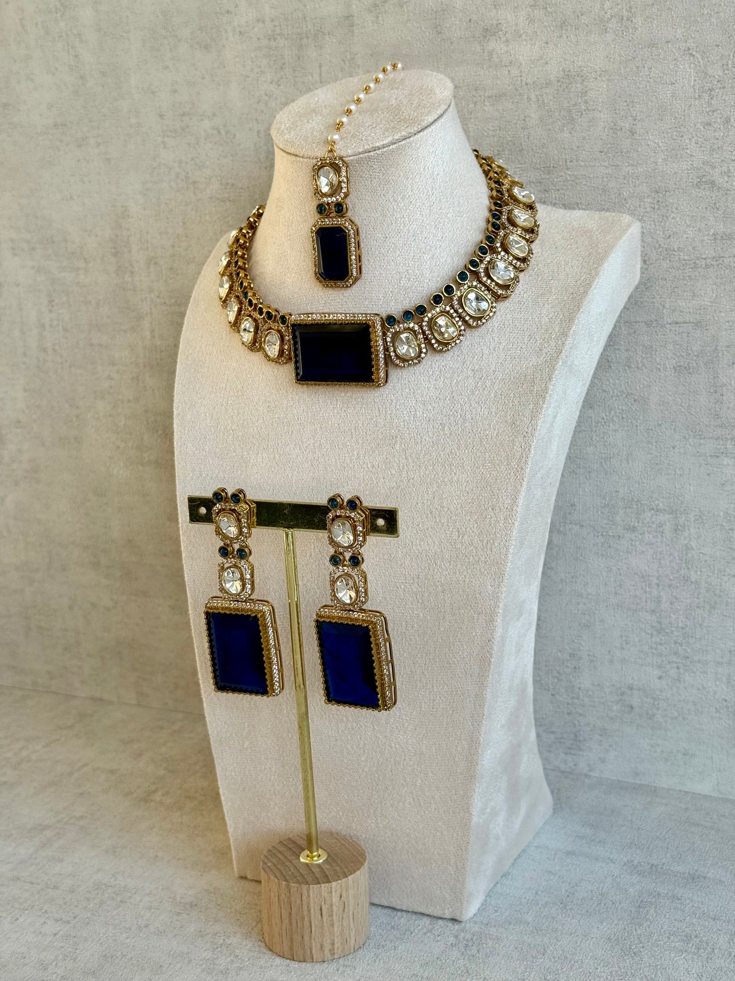 Ayura Designs Clara Set with Earrings & Tikka  – Royal Blue Stones with Moissanite and Antique Gold Finish