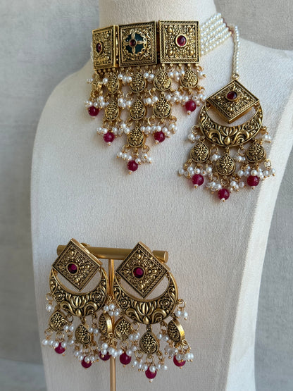 Ayura Designs Samera Choker Set with Earrings & Tikka – Rani Pink Beads, Pearl Detailing, Green Centre Stone, Floral Motifs & Antique Gold Finish