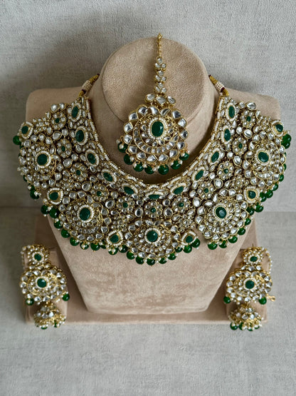 Ayura Designs Meherbano Bridal Set with Necklace, Jhumkis, Tikka, Nath, Ring & Sheeshphool – Jadau Kundan Craftsmanship with Mirror-Cut Polki, Emerald Green Stones & Antique Gold Finish