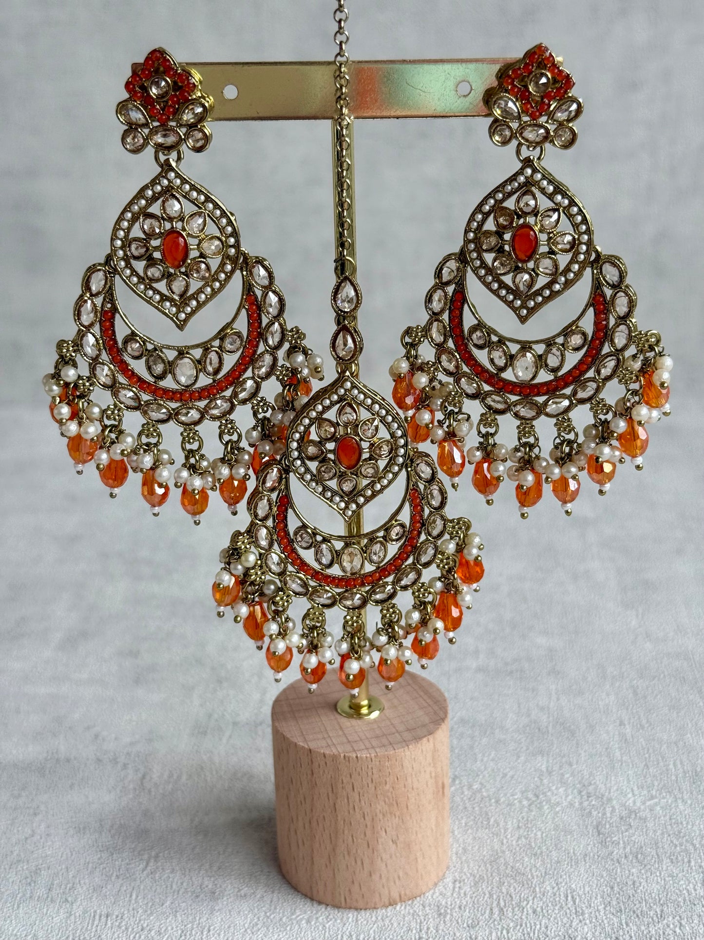 Ayura Designs Jazba Set with Necklace, Jhumkis & Tikka – Antique Gold, Mirror-Cut Stones, Pearl Detailing & Fiery Orange Beads
