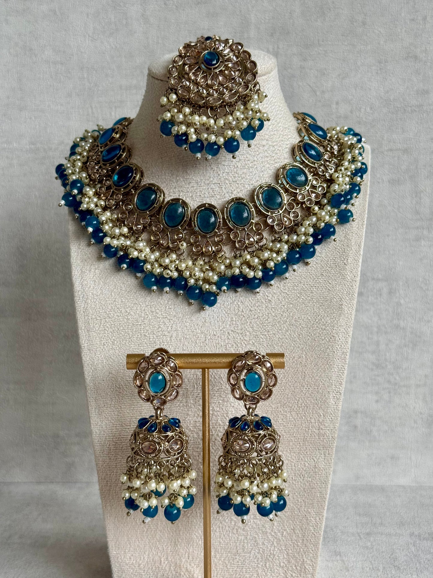 Ayura Designs Zubi Set with Jhumkis & Tikka – Deep Blue Stones, Pearl Detailing & Antique Gold Finish