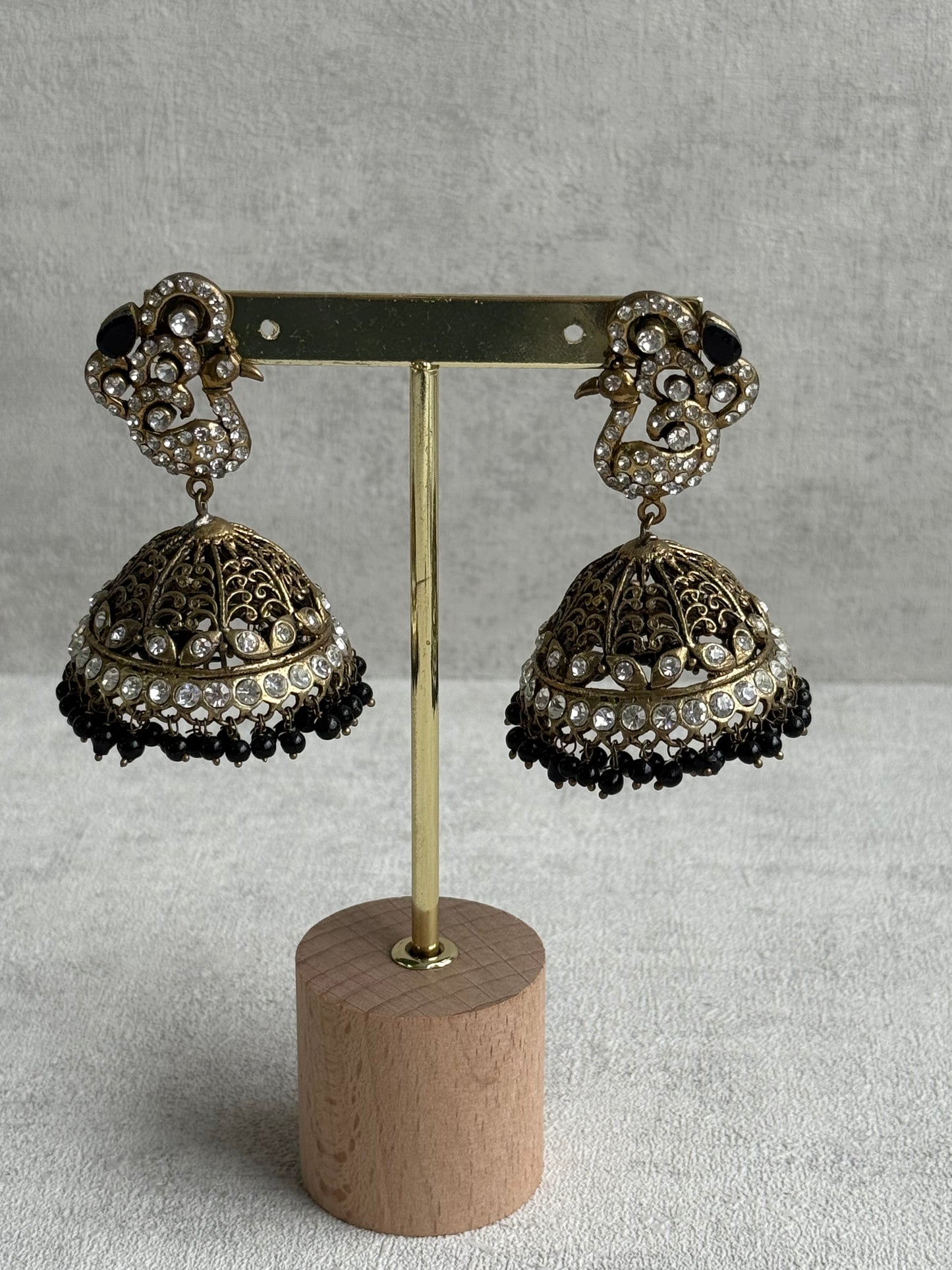 Ayura Designs Mayurika Jhumkis – Antique Gold Jhumkis with Crystal Stones, Black Beads & Peacock Motif