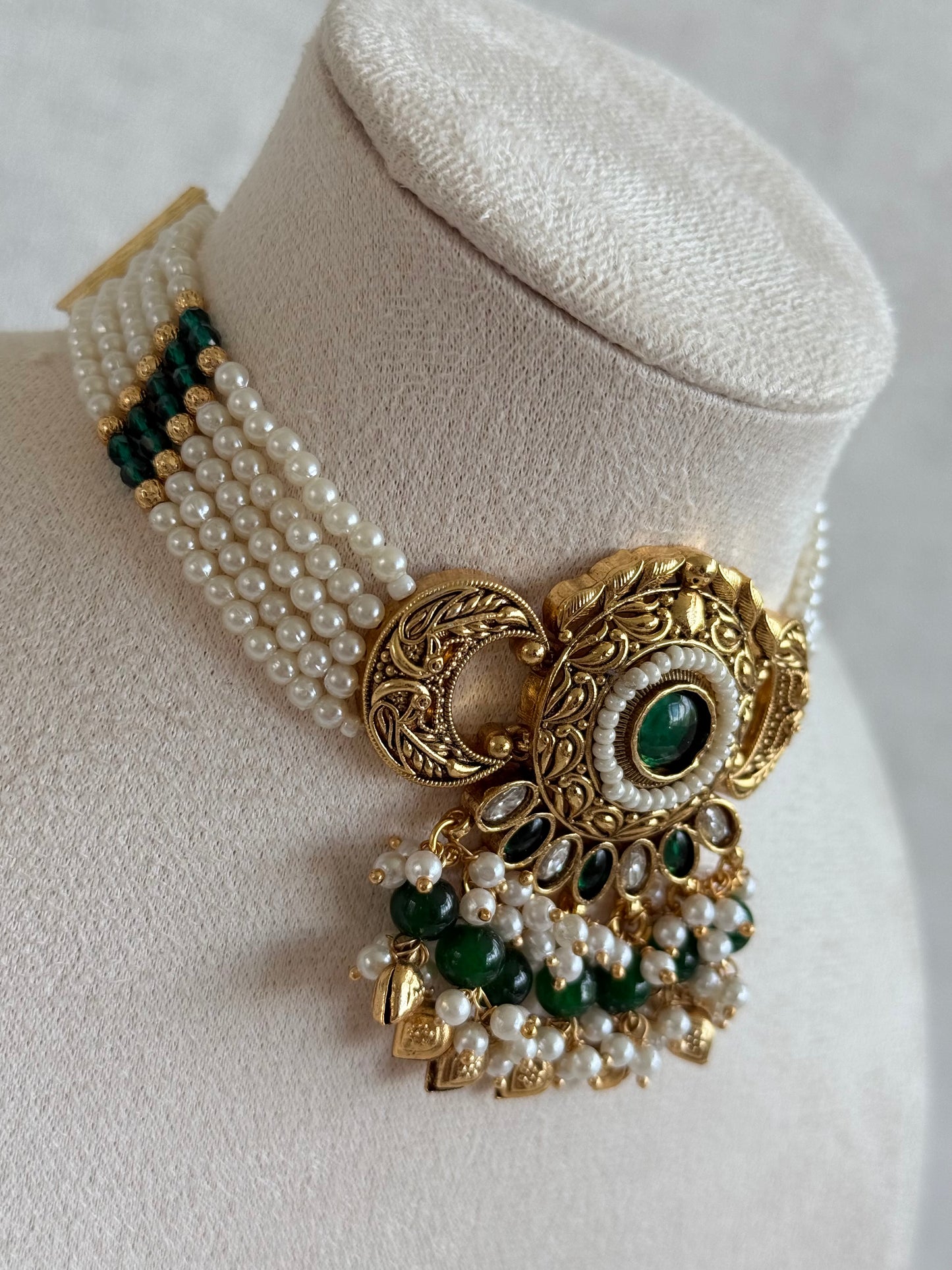 Ayura Designs Mehr Choker Set with Earrings & Tikka – Emerald Green Stones, Pearl Beads, Pearl Strands & Antique Gold Finish